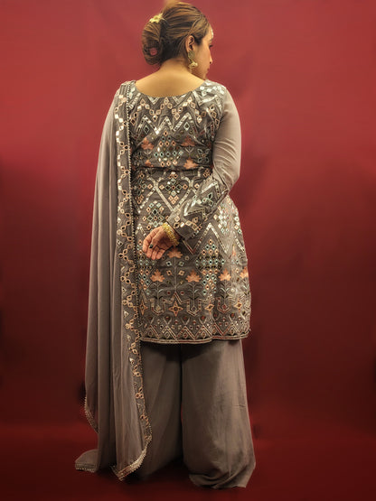 Embrace elegance with a light grey Indowestern Sharara set, meticulously crafted with foil and thread on georgette making it a sophisticated choice for any arty wear collection.