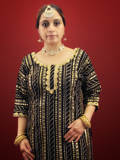 This black kameez and sharara set with sequins is perfect for a variety of occasions, from festive celebrations, to wedding events, making it a versatile choice for those seeking a blend of traditional and indo-western ethnic wear. It is ideal for adding a touch of glamour to any special occasion.