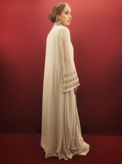 Introducing our latest Indo-Western Palazzo Dress, crafted from high-quality georgette fabric in a light sky blue color with intricate bead work, perfect for party wear and festive occasions. The palazzo pants are designed with a modern and trendy style, giving you the perfect balance of style and comfort. Order yours today and stand out from the crowd at your next special occasion.