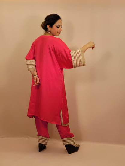 Rani Pink Satin Indowestern Dress with beautiful laced neck, sleeves and pants.