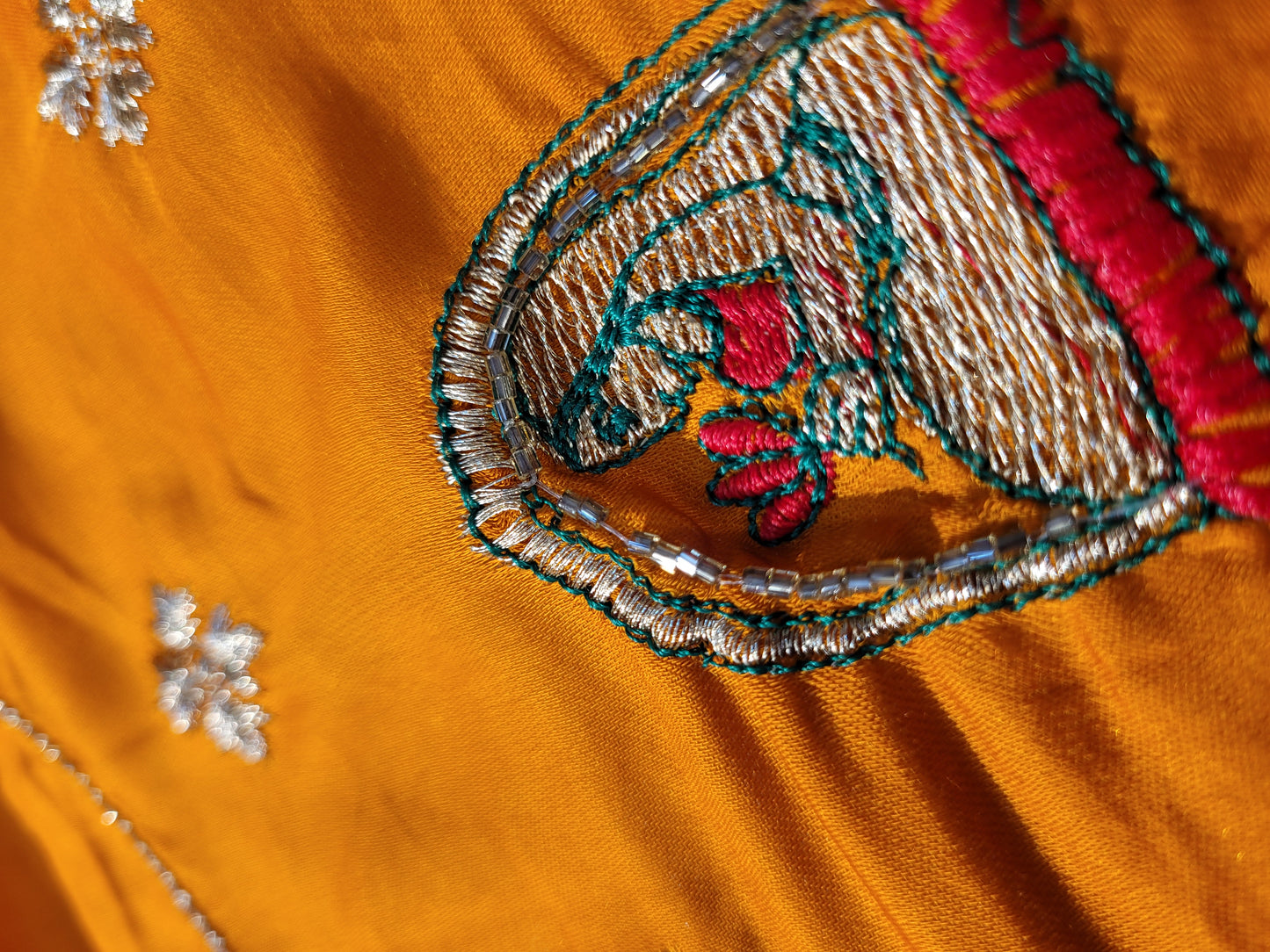 This beautiful mustard yellow silk saree with a beautiful maroon pallu that makes it stand out from the crowd. The saree features intricate cutdana, zari, and thread work that gives it a touch of elegance and class. This saree is perfect for any party, wedding, or even as a bridal wear.