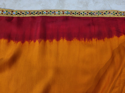 This beautiful mustard yellow silk saree with a beautiful maroon pallu that makes it stand out from the crowd. The saree features intricate cutdana, zari, and thread work that gives it a touch of elegance and class. This saree is perfect for any party, wedding, or even as a bridal wear.