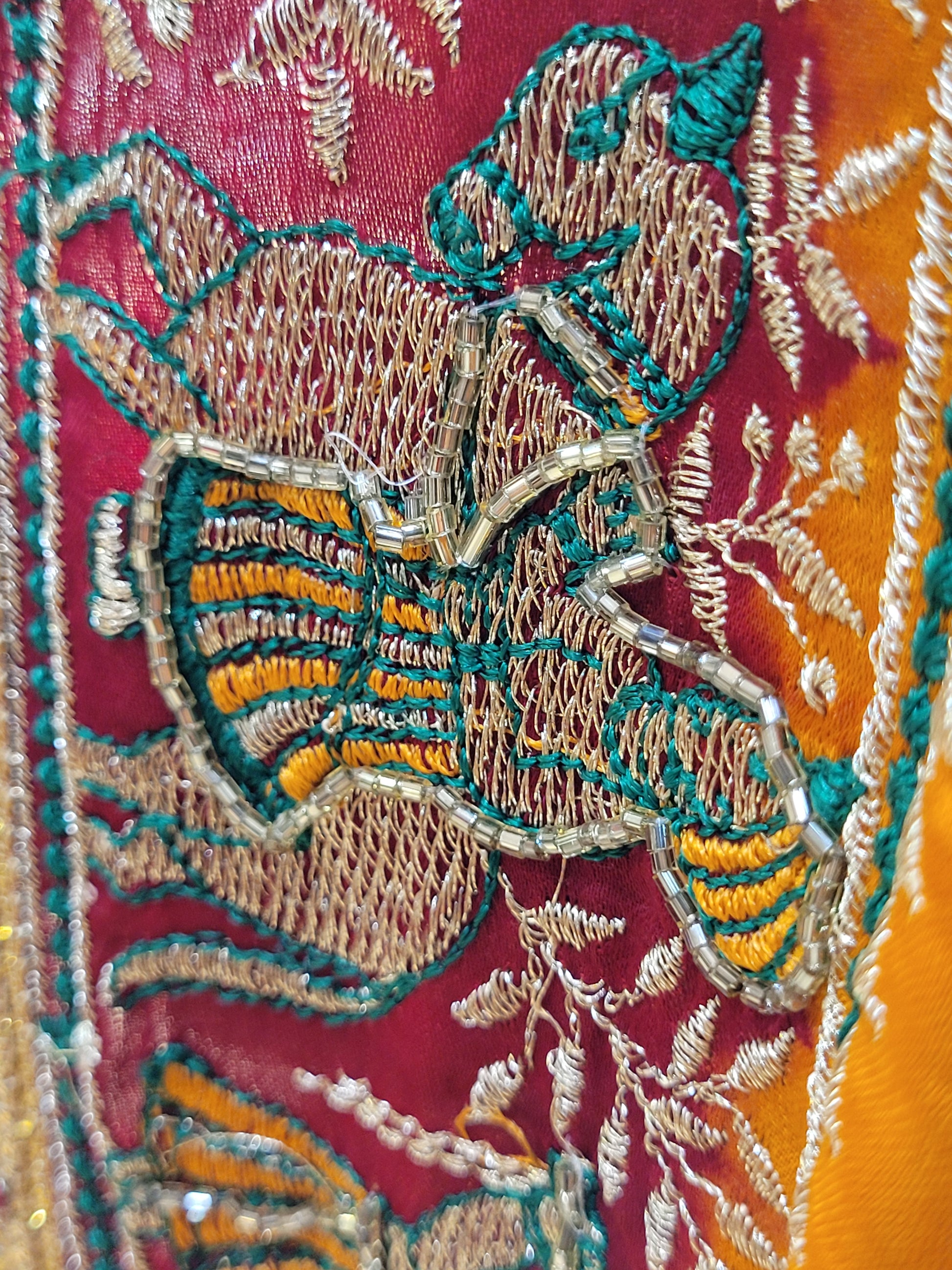 This beautiful mustard yellow silk saree with a beautiful maroon pallu that makes it stand out from the crowd. The saree features intricate cutdana, zari, and thread work that gives it a touch of elegance and class. This saree is perfect for any party, wedding, or even as a bridal wear.