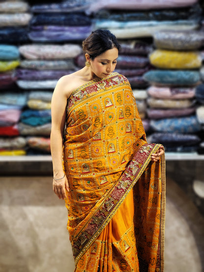 This beautiful mustard yellow silk saree with a beautiful maroon pallu that makes it stand out from the crowd. The saree features intricate cutdana, zari, and thread work that gives it a touch of elegance and class. This saree is perfect for any party, wedding, or even as a bridal wear.