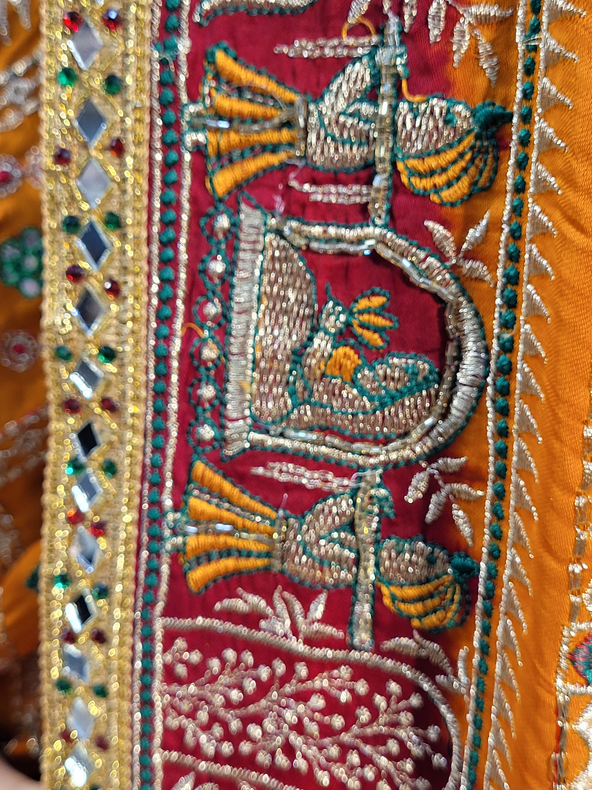 This beautiful mustard yellow silk saree with a beautiful maroon pallu that makes it stand out from the crowd. The saree features intricate cutdana, zari, and thread work that gives it a touch of elegance and class. This saree is perfect for any party, wedding, or even as a bridal wear.