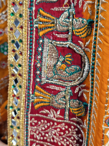 This beautiful mustard yellow silk saree with a beautiful maroon pallu that makes it stand out from the crowd. The saree features intricate cutdana, zari, and thread work that gives it a touch of elegance and class. This saree is perfect for any party, wedding, or even as a bridal wear.