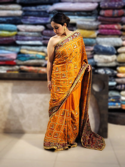 This beautiful mustard yellow silk saree with a beautiful maroon pallu that makes it stand out from the crowd. The saree features intricate cutdana, zari, and thread work that gives it a touch of elegance and class. This saree is perfect for any party, wedding, or even as a bridal wear.