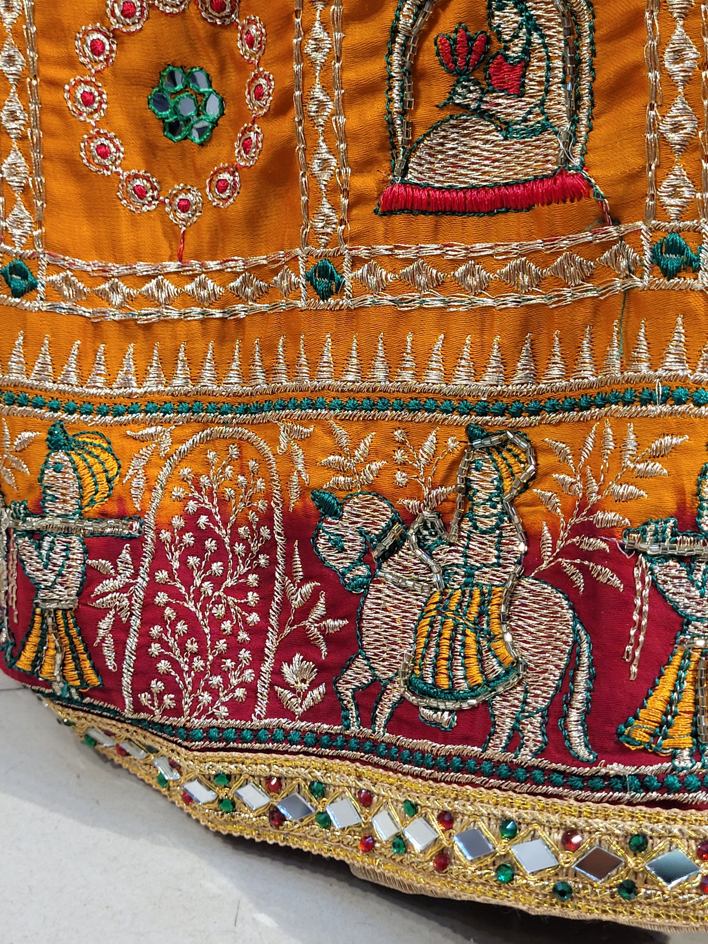 This beautiful mustard yellow silk saree with a beautiful maroon pallu that makes it stand out from the crowd. The saree features intricate cutdana, zari, and thread work that gives it a touch of elegance and class. This saree is perfect for any party, wedding, or even as a bridal wear.