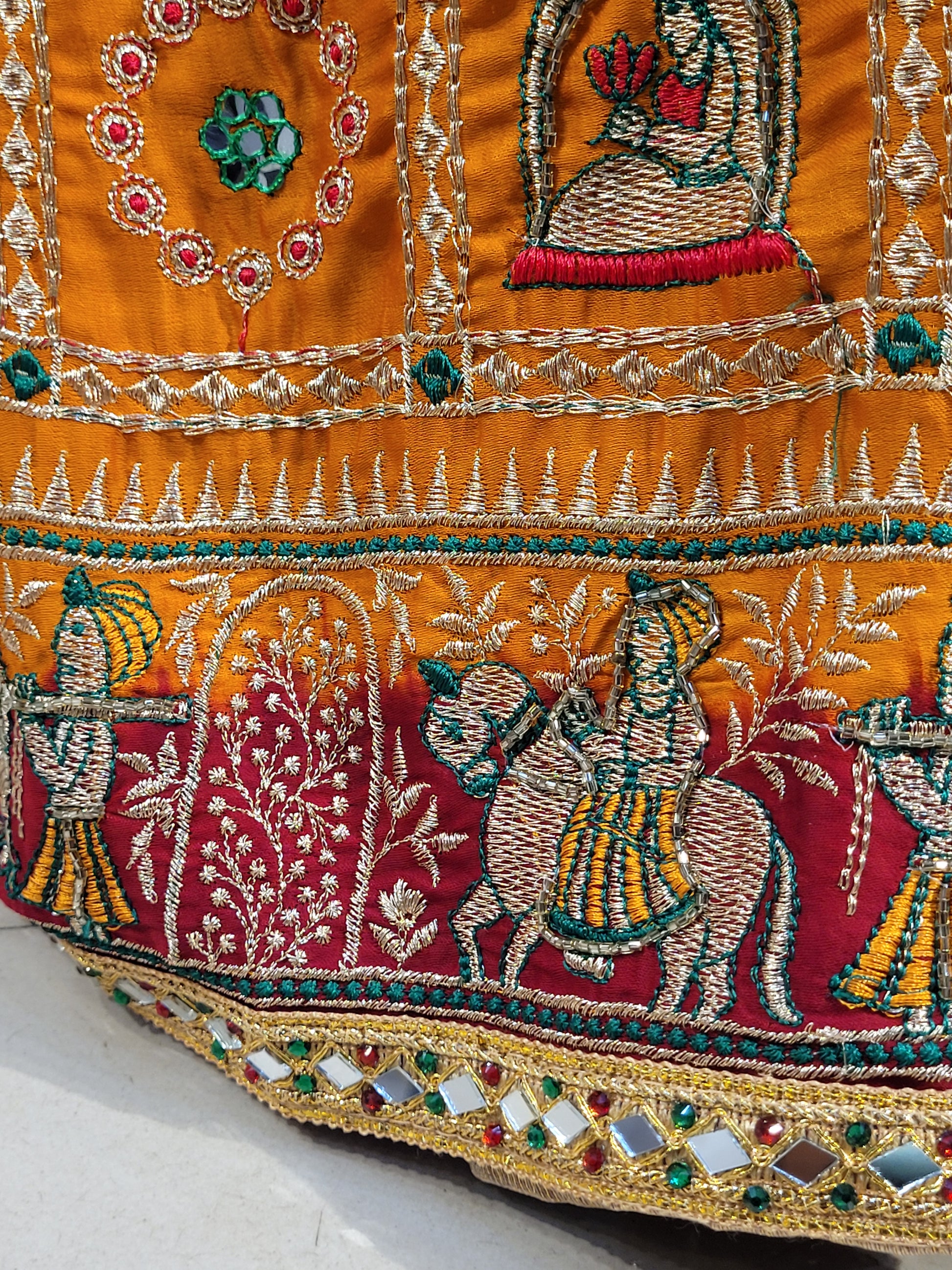 This beautiful mustard yellow silk saree with a beautiful maroon pallu that makes it stand out from the crowd. The saree features intricate cutdana, zari, and thread work that gives it a touch of elegance and class. This saree is perfect for any party, wedding, or even as a bridal wear.