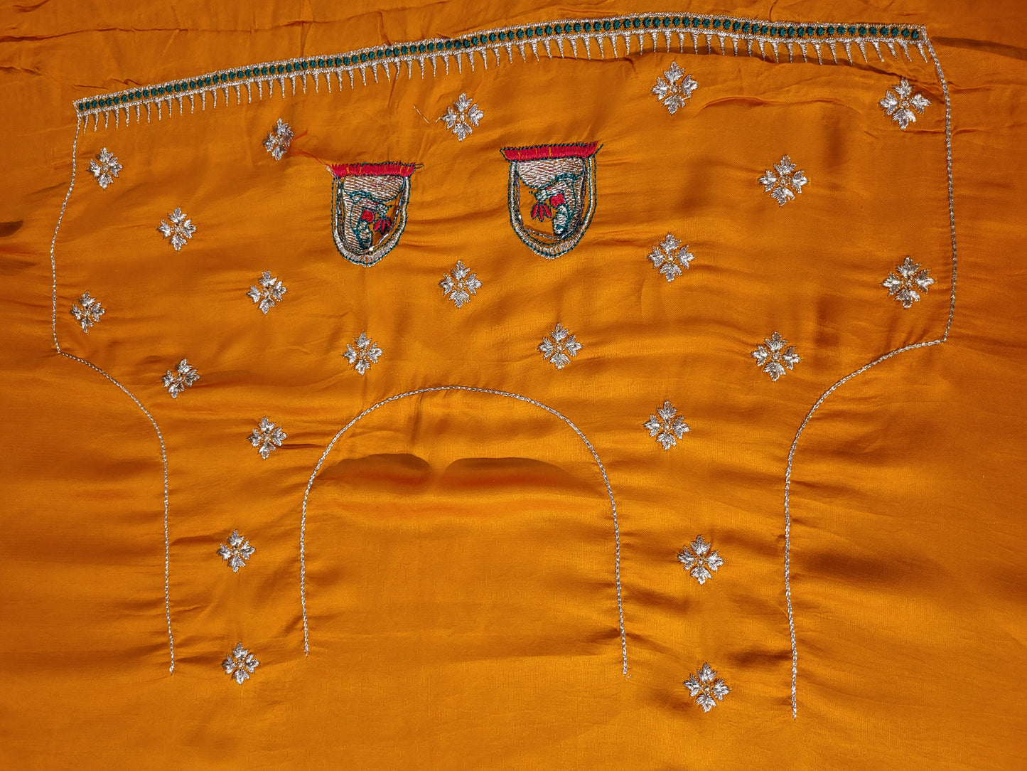 This beautiful mustard yellow silk saree with a beautiful maroon pallu that makes it stand out from the crowd. The saree features intricate cutdana, zari, and thread work that gives it a touch of elegance and class. This saree is perfect for any party, wedding, or even as a bridal wear.