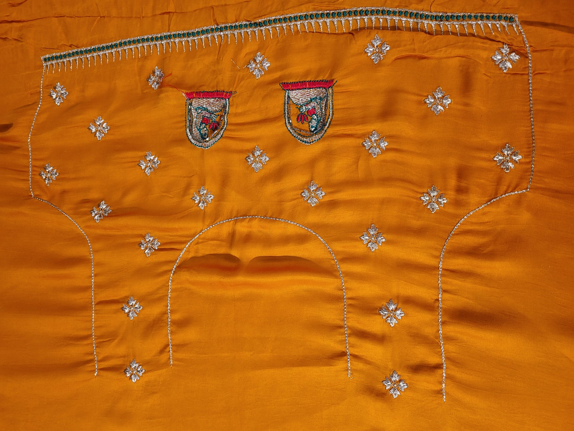 This beautiful mustard yellow silk saree with a beautiful maroon pallu that makes it stand out from the crowd. The saree features intricate cutdana, zari, and thread work that gives it a touch of elegance and class. This saree is perfect for any party, wedding, or even as a bridal wear.