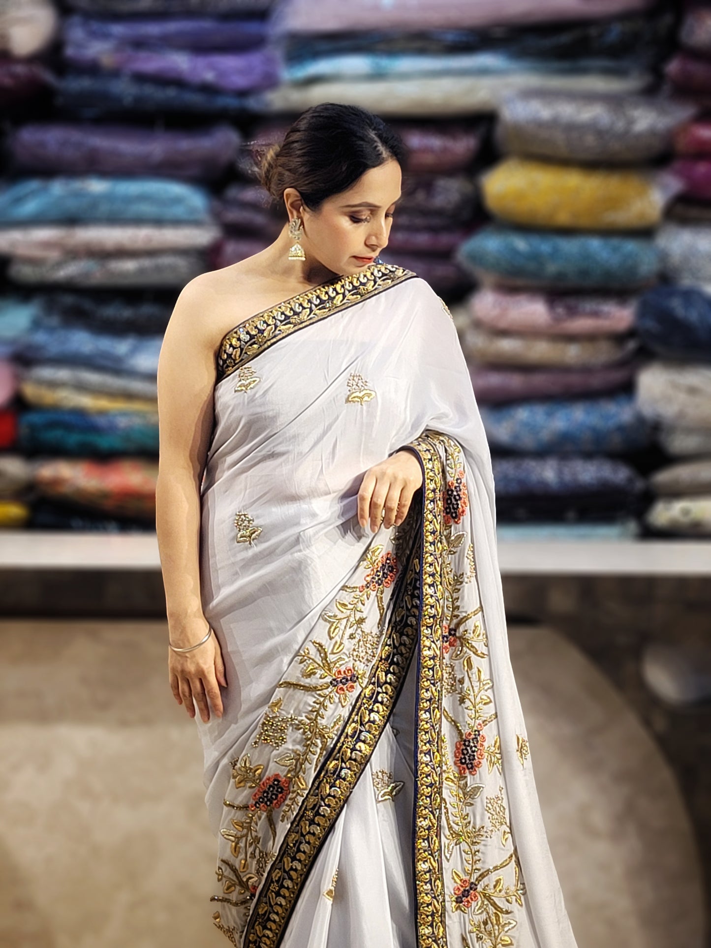 Grey Crepe Saree with Blue Border. Handwork using Zari and Moti. Heavy unstitched Blouse Piece.