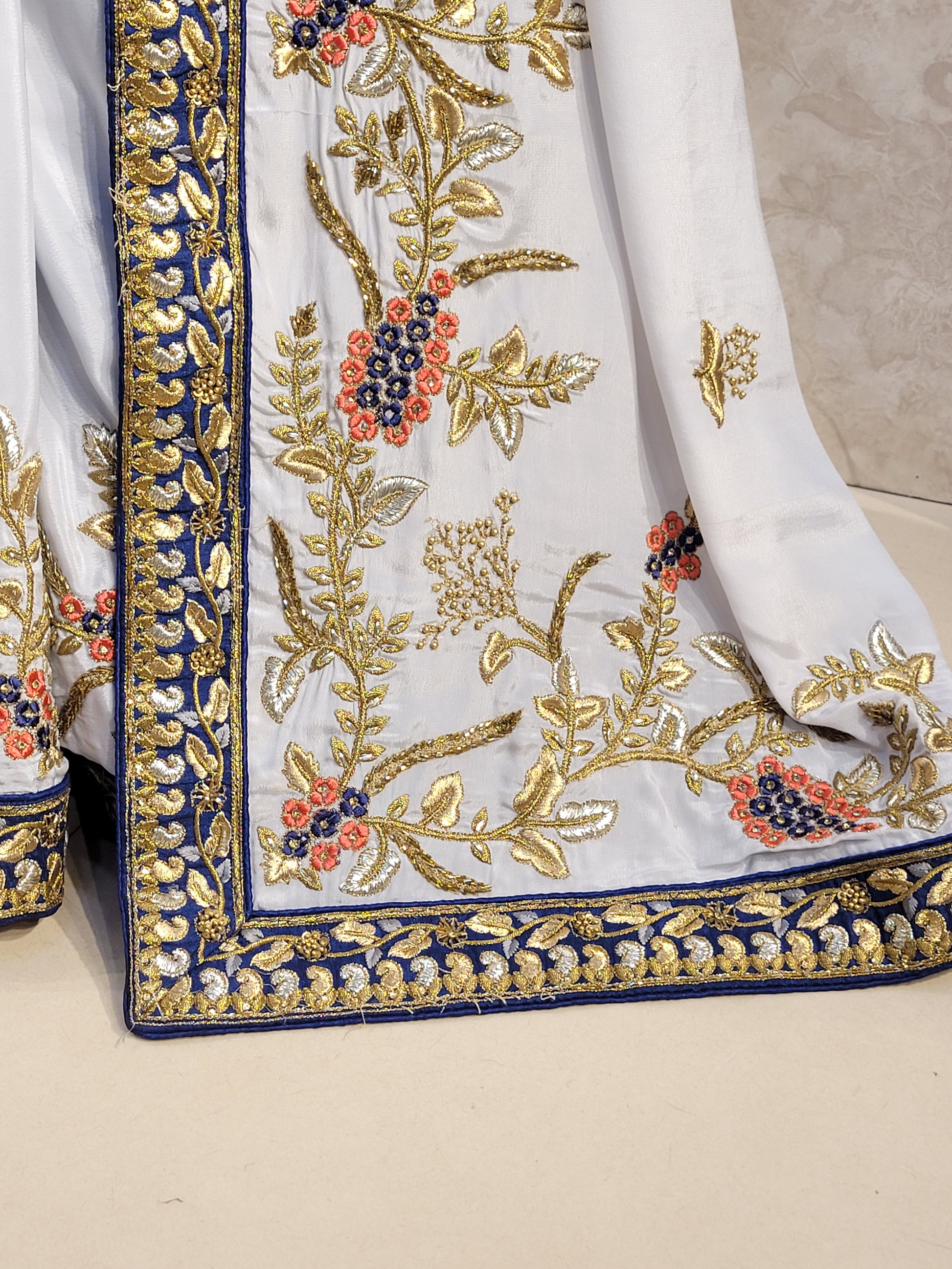 Grey Crepe Saree with Blue Border. Handwork using Zari and Moti. Heavy unstitched Blouse Piece.