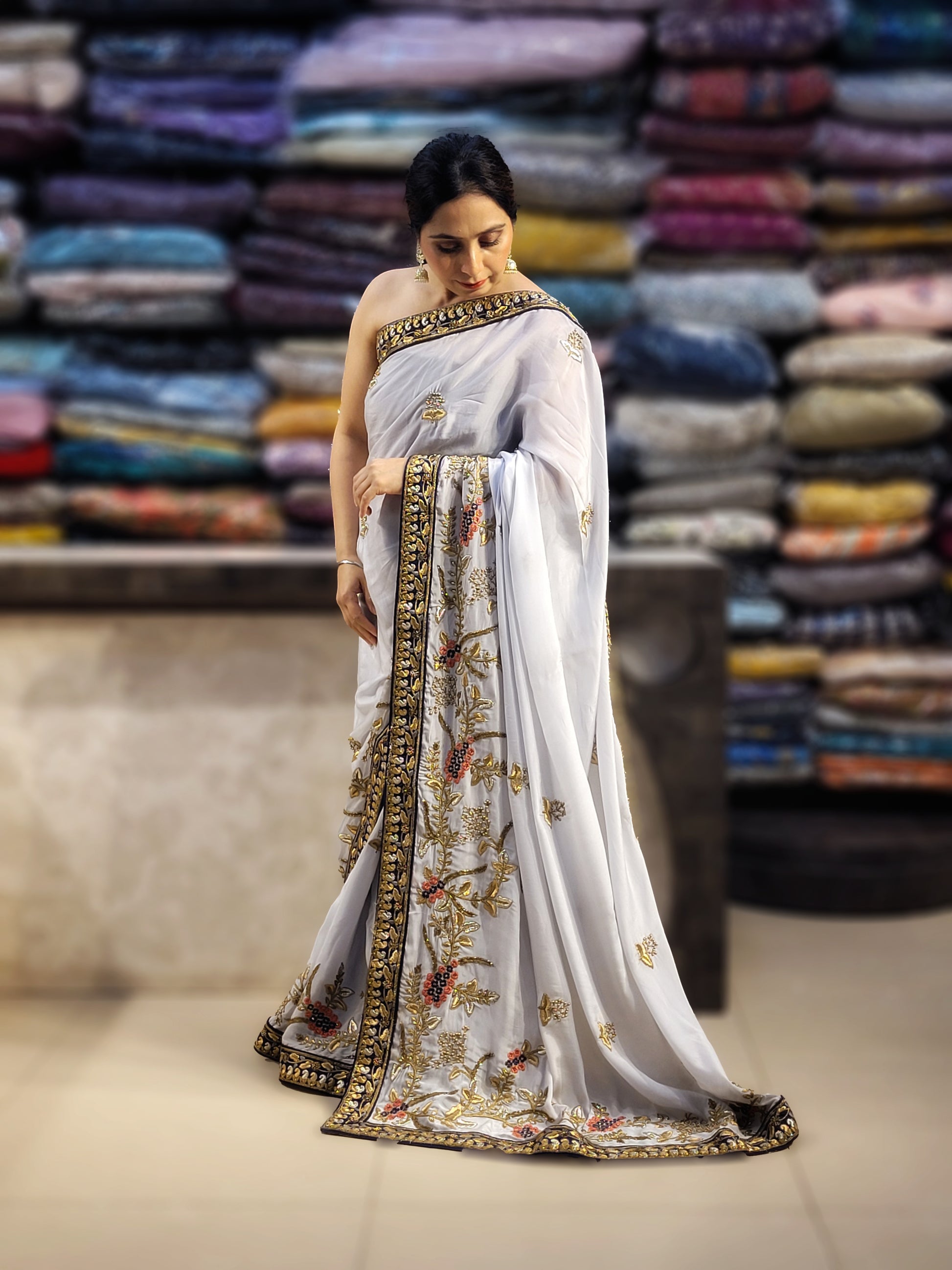 Grey Crepe Saree with Blue Border. Handwork using Zari and Moti. Heavy unstitched Blouse Piece.