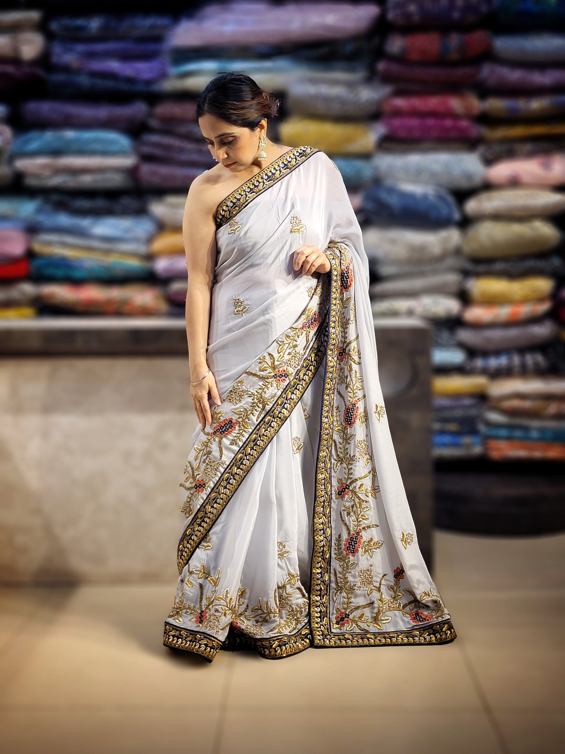 Grey Crepe Saree with Blue Border. Handwork using Zari and Moti. Heavy unstitched Blouse Piece.