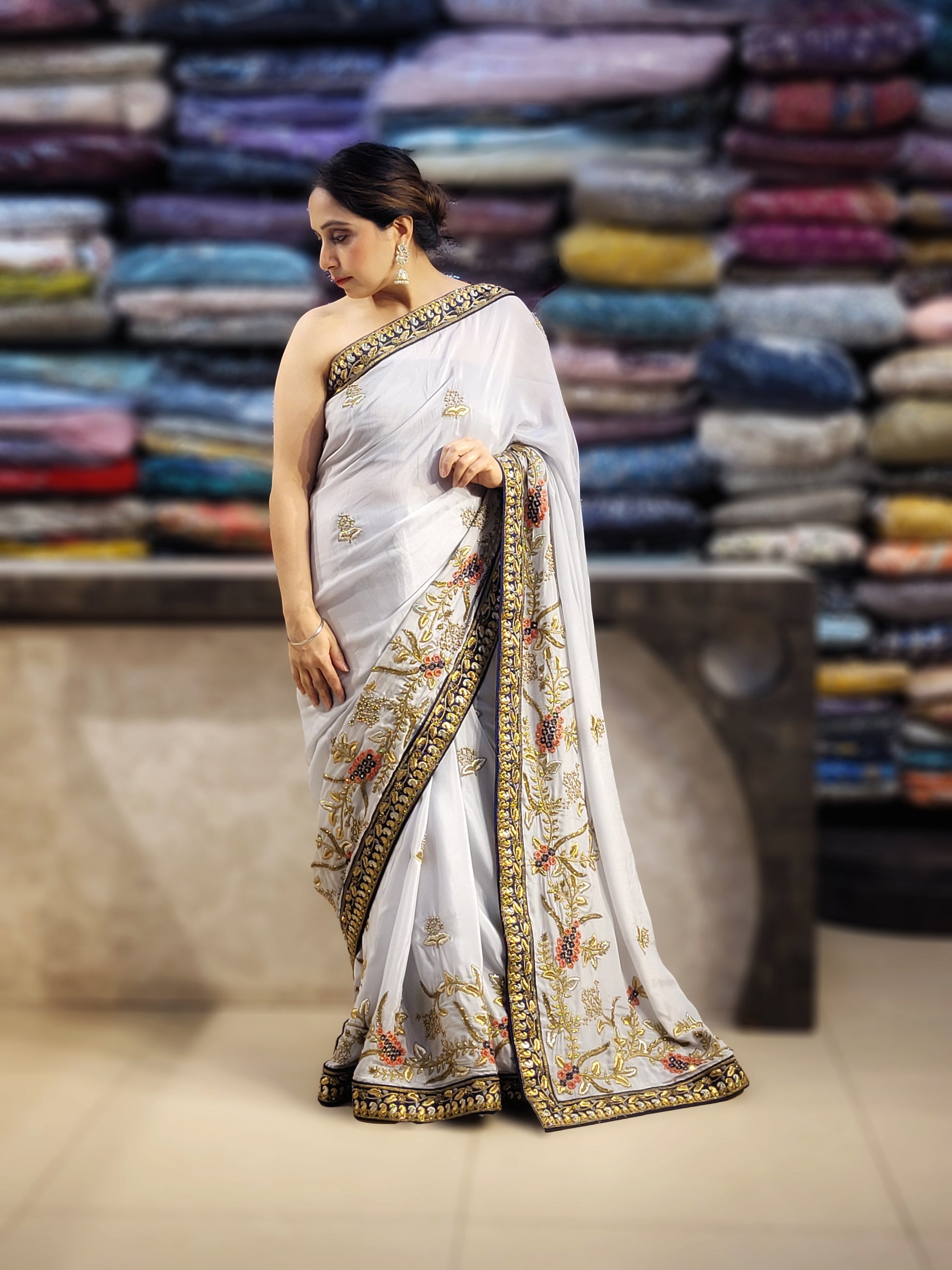 Grey Crepe Saree with Blue Border. Handwork using Zari and Moti. Heavy unstitched Blouse Piece.
