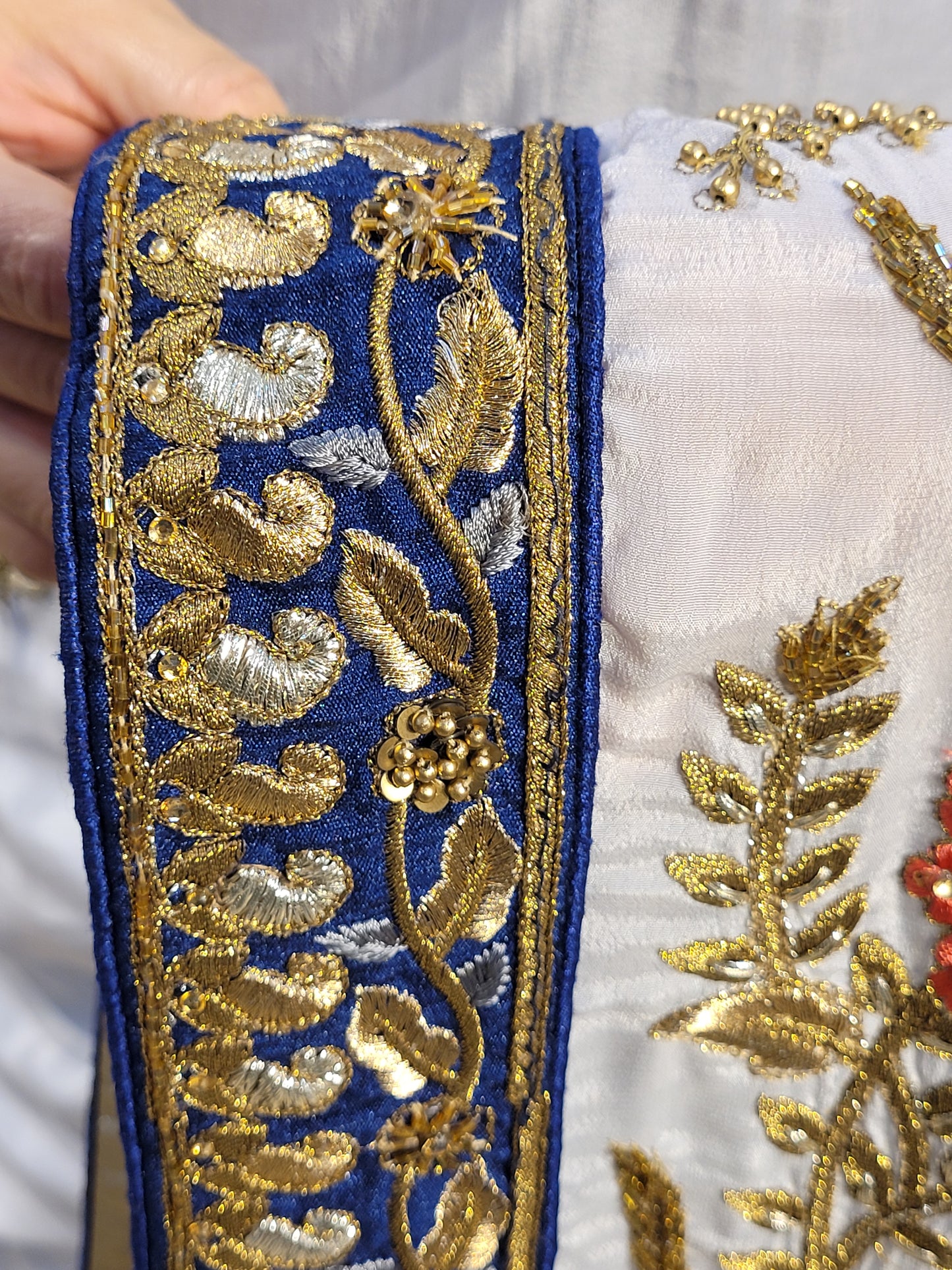 Grey Crepe Saree with Blue Border. Handwork using Zari and Moti. Heavy unstitched Blouse Piece.