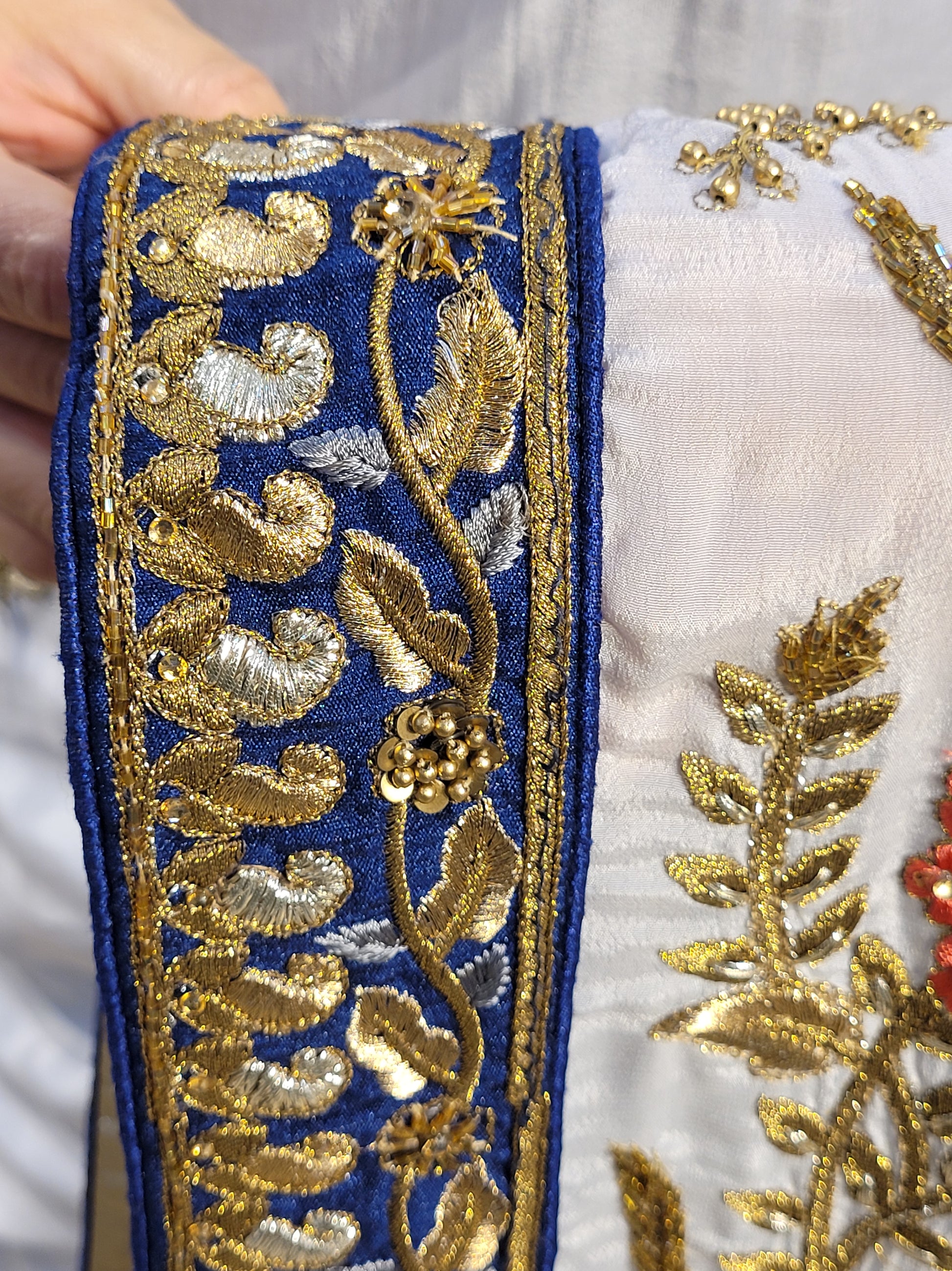 Grey Crepe Saree with Blue Border. Handwork using Zari and Moti. Heavy unstitched Blouse Piece.