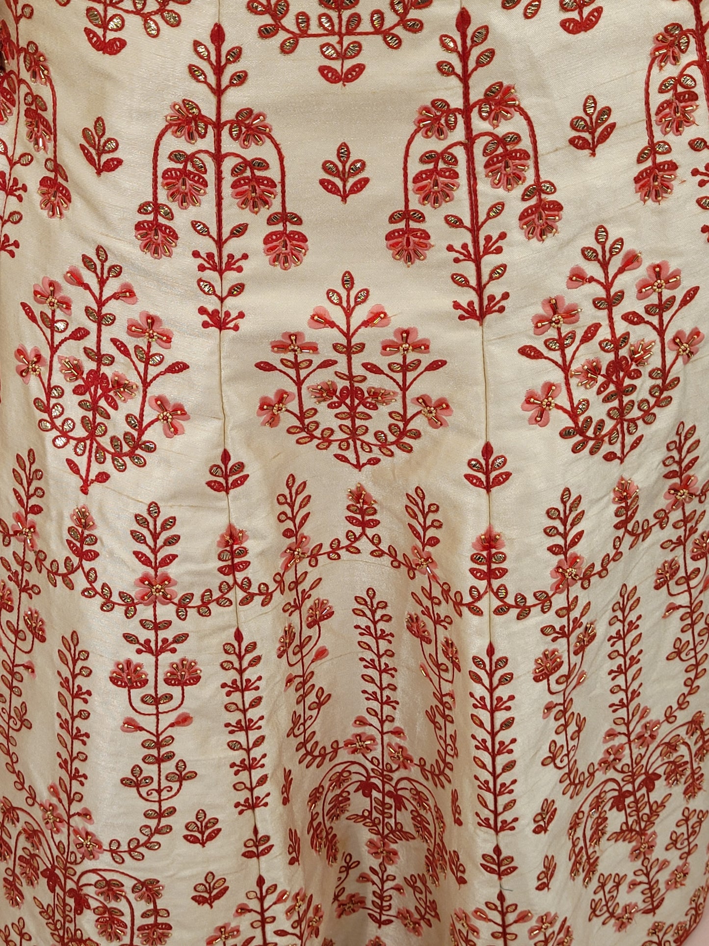 Immerse yourself in the elegance of Indian tradition with this exquisite Cream color silk unstitched lehenga, inspired by the renowned designer Anita Dongre. This lehenga is a true masterpiece, featuring intricate resham embroidery and delicate beads work that beautifully adorns the luxurious silk fabric, creating a captivating and sophisticated look.