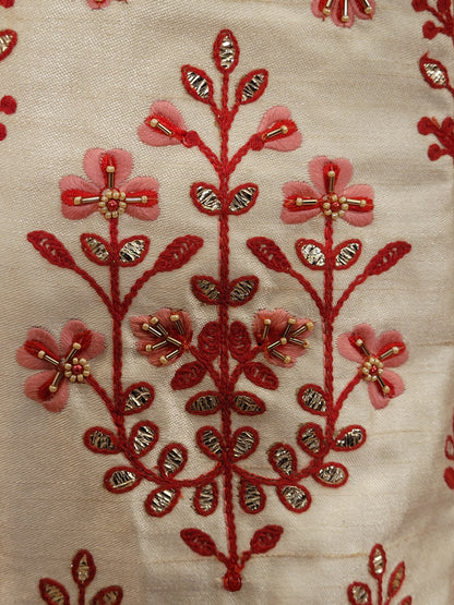 Immerse yourself in the elegance of Indian tradition with this exquisite Cream color silk unstitched lehenga, inspired by the renowned designer Anita Dongre. This lehenga is a true masterpiece, featuring intricate resham embroidery and delicate beads work that beautifully adorns the luxurious silk fabric, creating a captivating and sophisticated look.