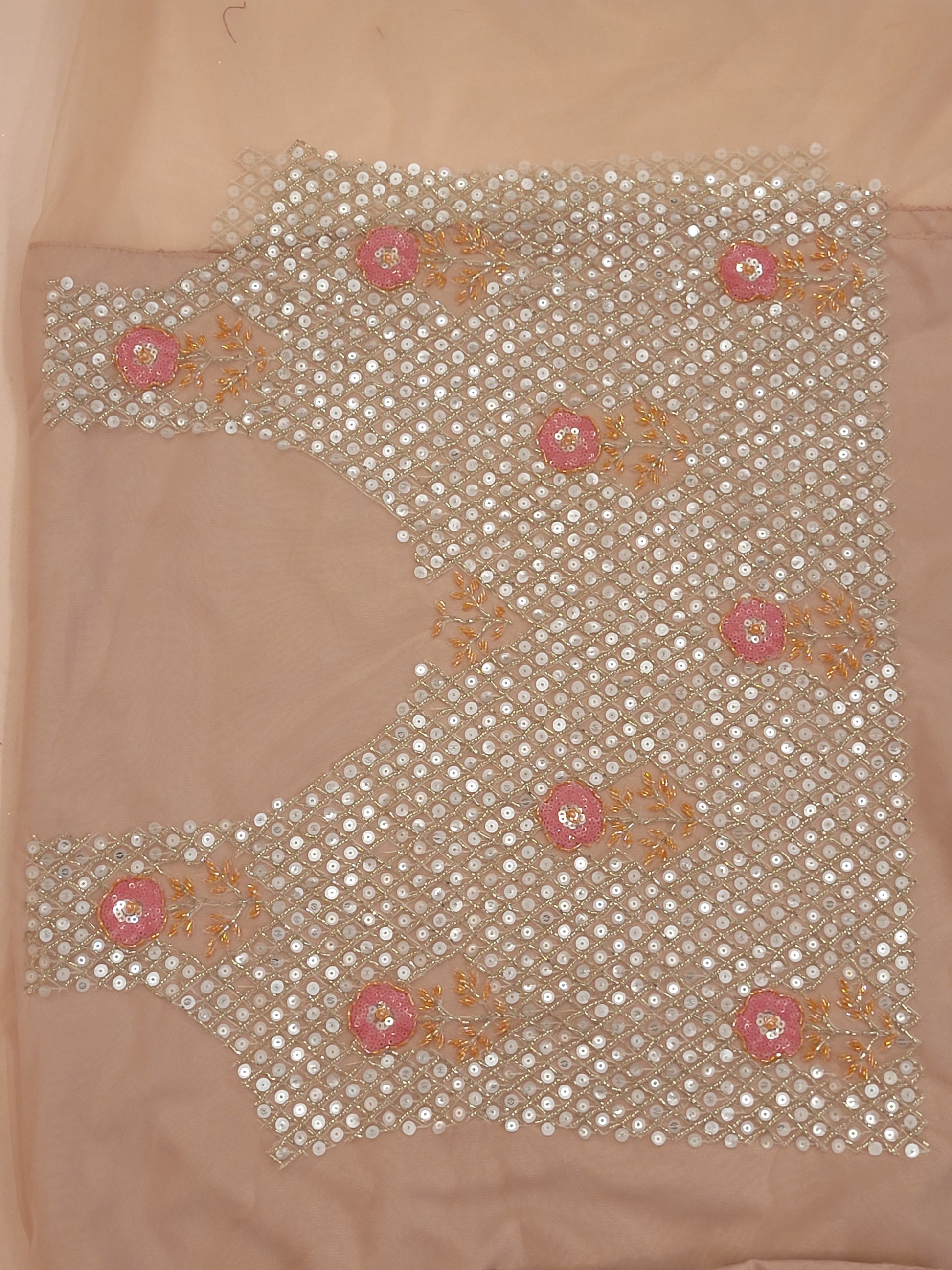Elevate your ethnic wardrobe with this stunning ivory-colored net unstitched lehenga, a perfect blend of traditional craftsmanship and contemporary elegance. This lehenga is intricately adorned with shimmering water sequins and delicate glass beads work, creating a mesmerizing effect that catches the light with every movement.