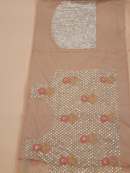 Elevate your ethnic wardrobe with this stunning ivory-colored net unstitched lehenga, a perfect blend of traditional craftsmanship and contemporary elegance. This lehenga is intricately adorned with shimmering water sequins and delicate glass beads work, creating a mesmerizing effect that catches the light with every movement.