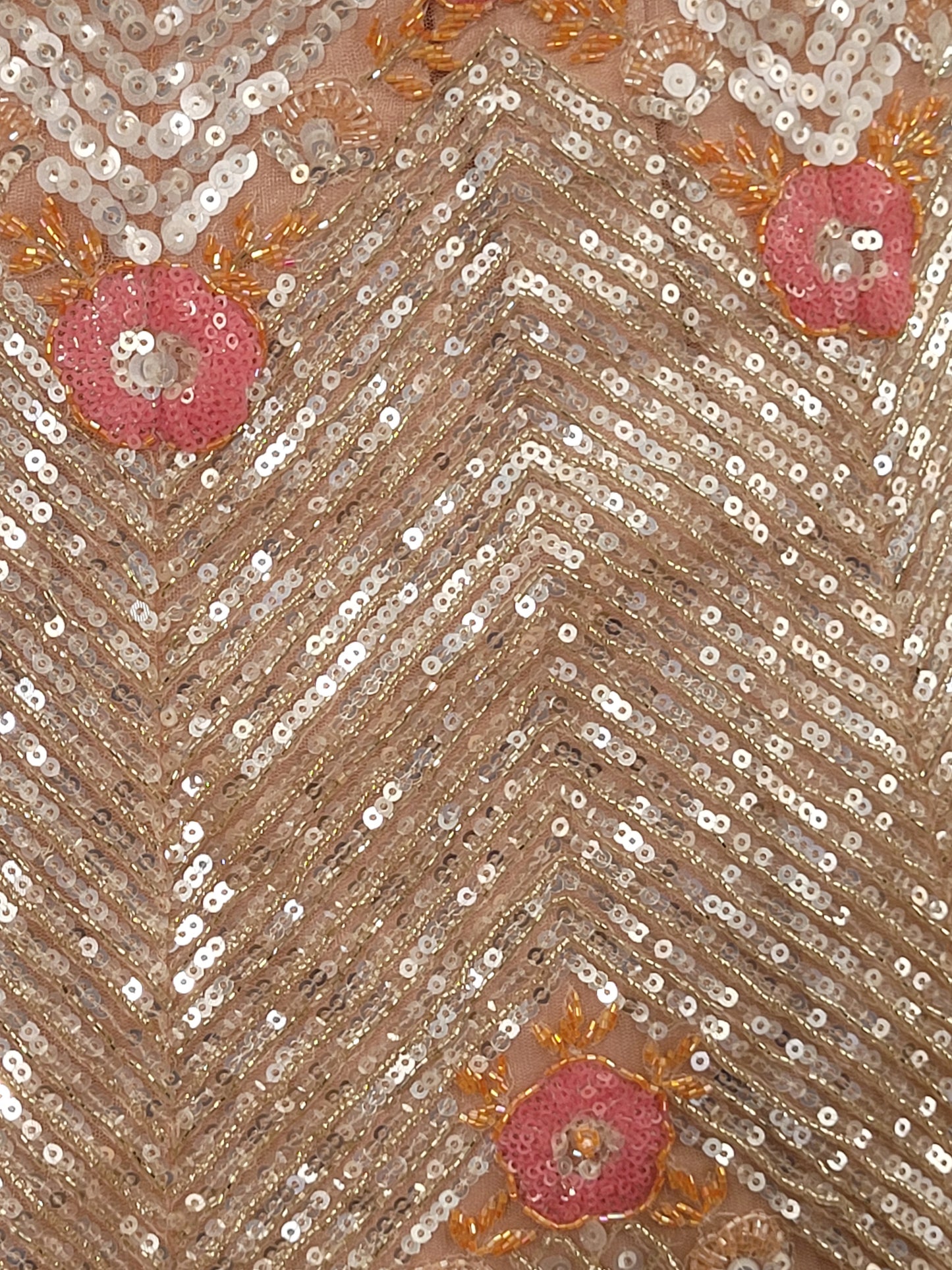 Elevate your ethnic wardrobe with this stunning ivory-colored net unstitched lehenga, a perfect blend of traditional craftsmanship and contemporary elegance. This lehenga is intricately adorned with shimmering water sequins and delicate glass beads work, creating a mesmerizing effect that catches the light with every movement.