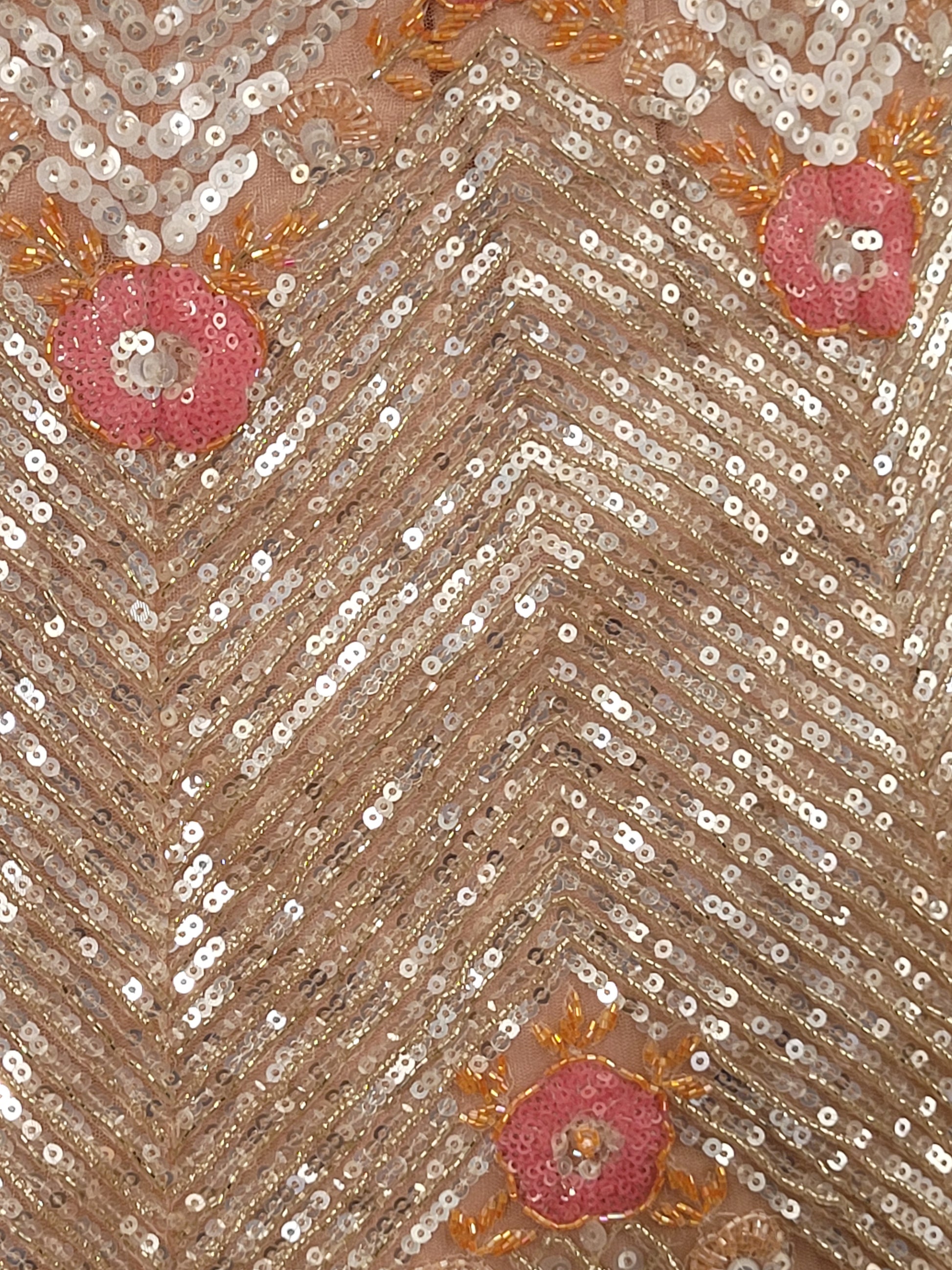Elevate your ethnic wardrobe with this stunning ivory-colored net unstitched lehenga, a perfect blend of traditional craftsmanship and contemporary elegance. This lehenga is intricately adorned with shimmering water sequins and delicate glass beads work, creating a mesmerizing effect that catches the light with every movement.