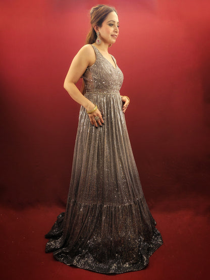 The perfect gown to wear to your upcoming engagement, cocktail party, or wedding reception. Allow us to introduce you to this stunning silver grey gown made from imported fabric and adorned with intricate cutdana beads and sequins work.