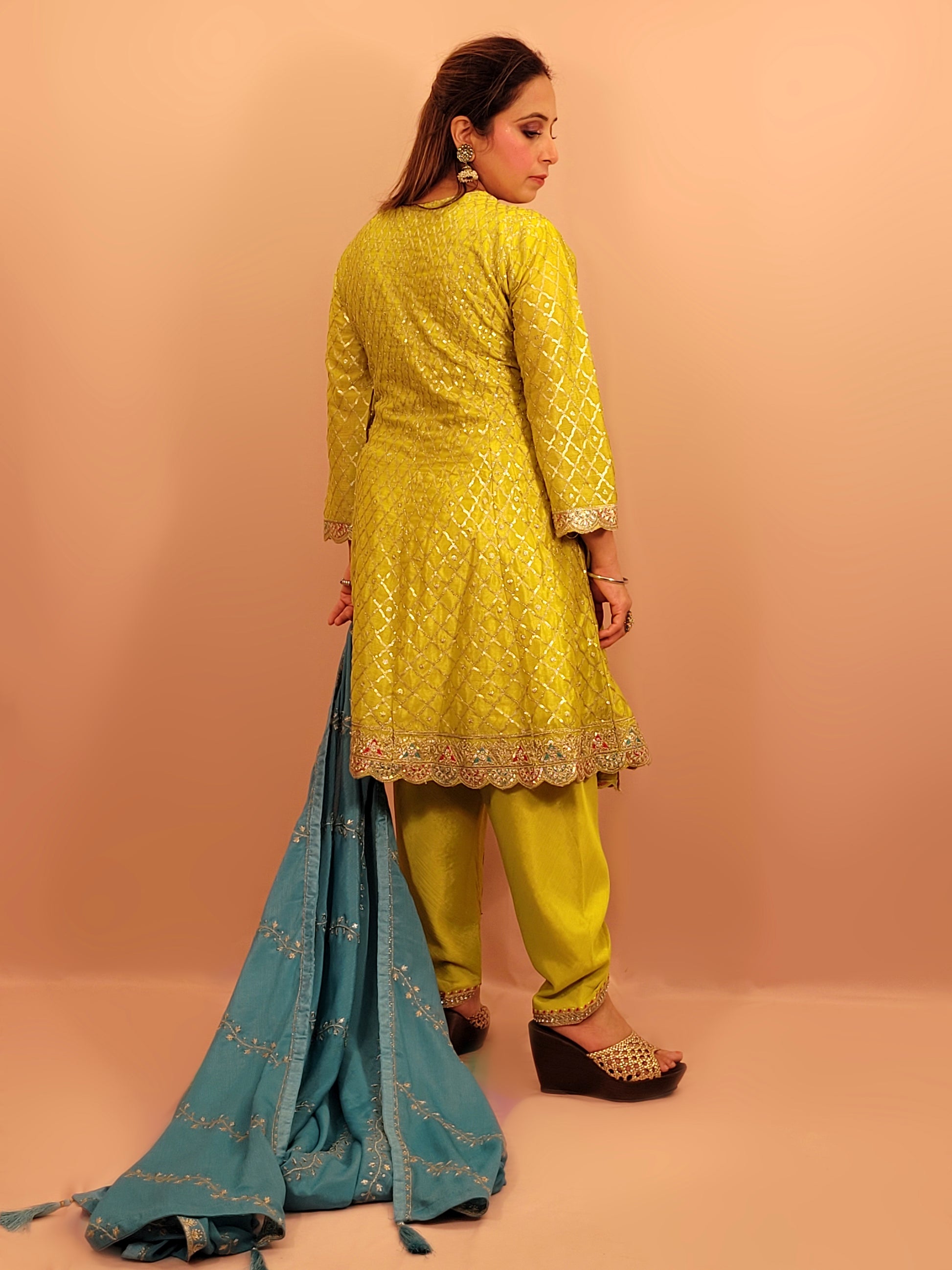 Green Chinnon Anarkali with matching Tulip Pants. Contrast neck yolk with resham, zari and sequins. Contrast Dupatta. Latest trend in Indian ethnic fusion wear.