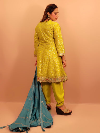 Green Chinnon Anarkali with matching Tulip Pants. Contrast neck yolk with resham, zari and sequins. Contrast Dupatta. Latest trend in Indian ethnic fusion wear.
