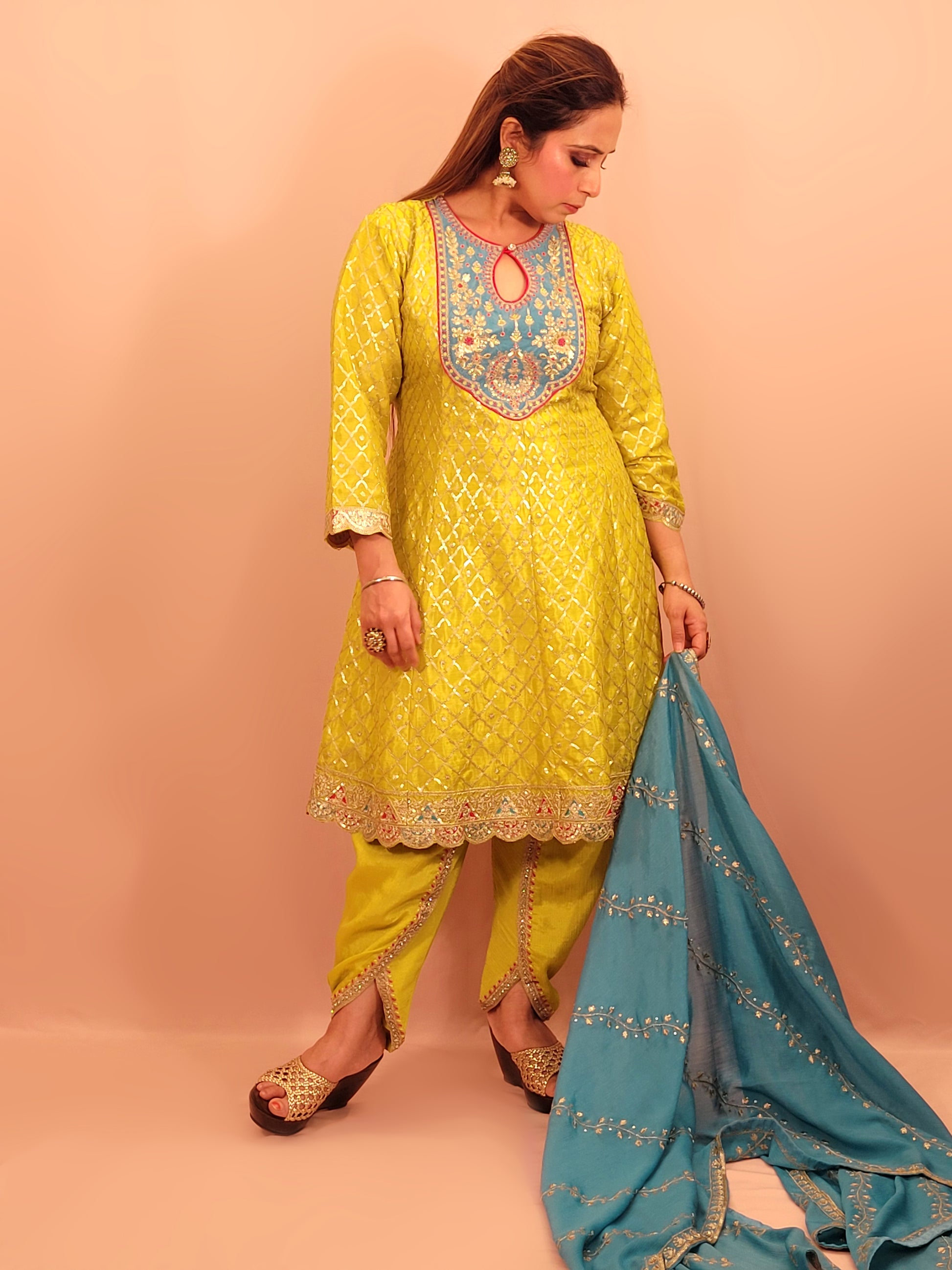Green Chinnon Anarkali with matching Tulip Pants. Contrast neck yolk with resham, zari and sequins. Contrast Dupatta. Latest trend in Indian ethnic fusion wear.