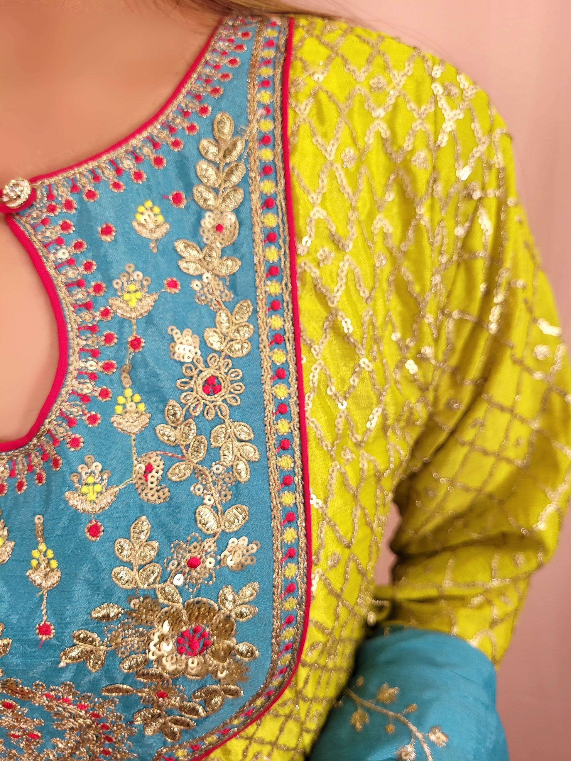 Green Chinnon Anarkali with matching Tulip Pants. Contrast neck yolk with resham, zari and sequins. Contrast Dupatta. Latest trend in Indian ethnic fusion wear.
