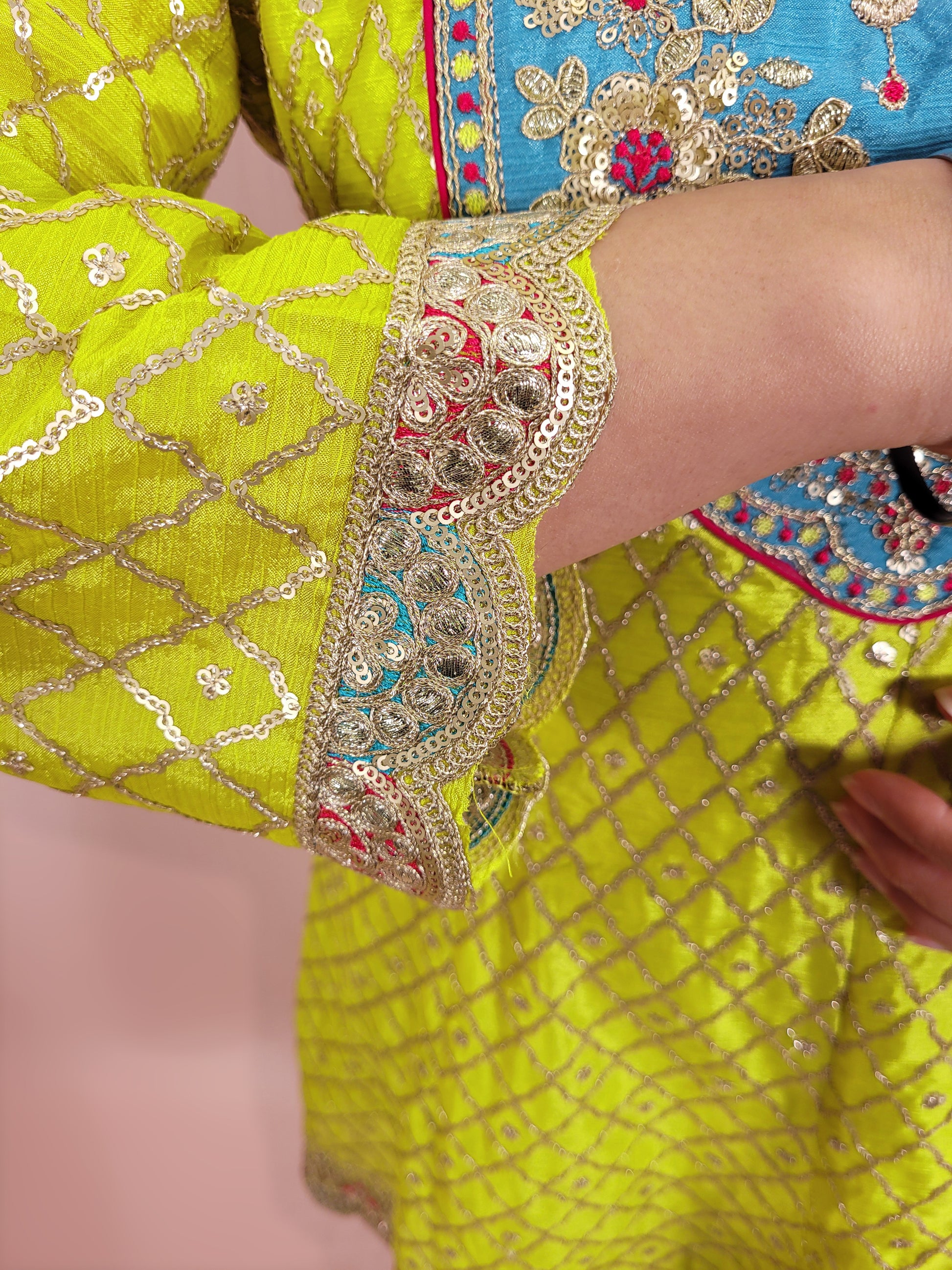 Green Chinnon Anarkali with matching Tulip Pants. Contrast neck yolk with resham, zari and sequins. Contrast Dupatta. Latest trend in Indian ethnic fusion wear.
