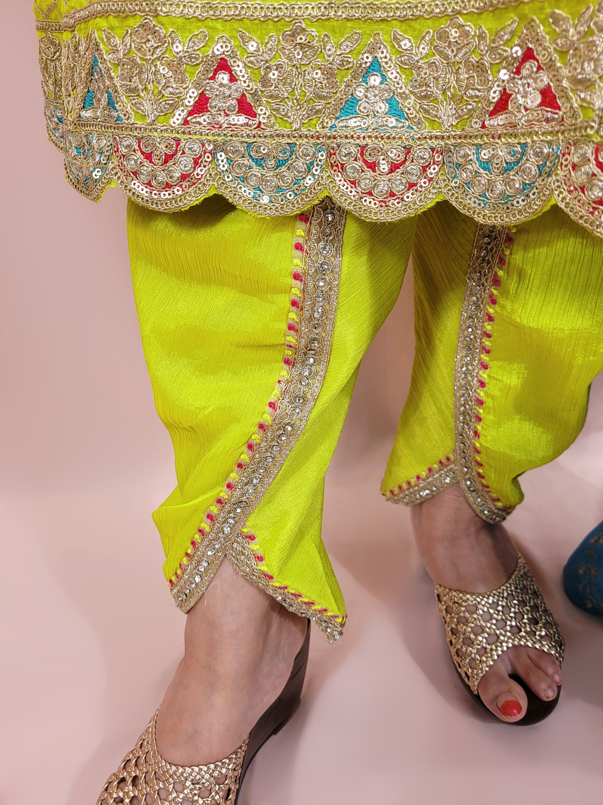 Green Chinnon Anarkali with matching Tulip Pants. Contrast neck yolk with resham, zari and sequins. Contrast Dupatta. Latest trend in Indian ethnic fusion wear.