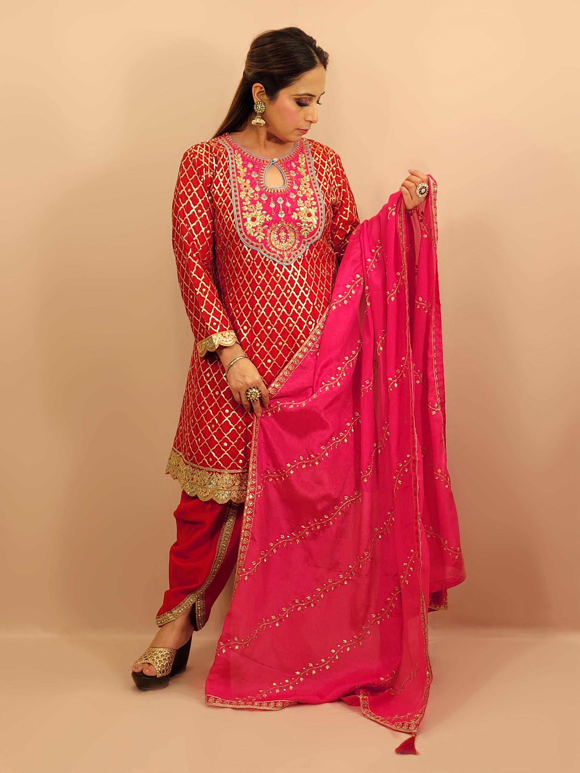 Red Chinnon Anarkali with matching Tulip Pants. Contrast neck yolk with resham, zari and sequins. Contrast Dupatta. Latest trend in Indian ethnic fusion wear.