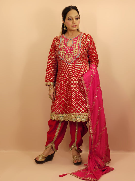 Red Chinnon Anarkali with matching Tulip Pants. Contrast neck yolk with resham, zari and sequins. Contrast Dupatta. Latest trend in Indian ethnic fusion wear.