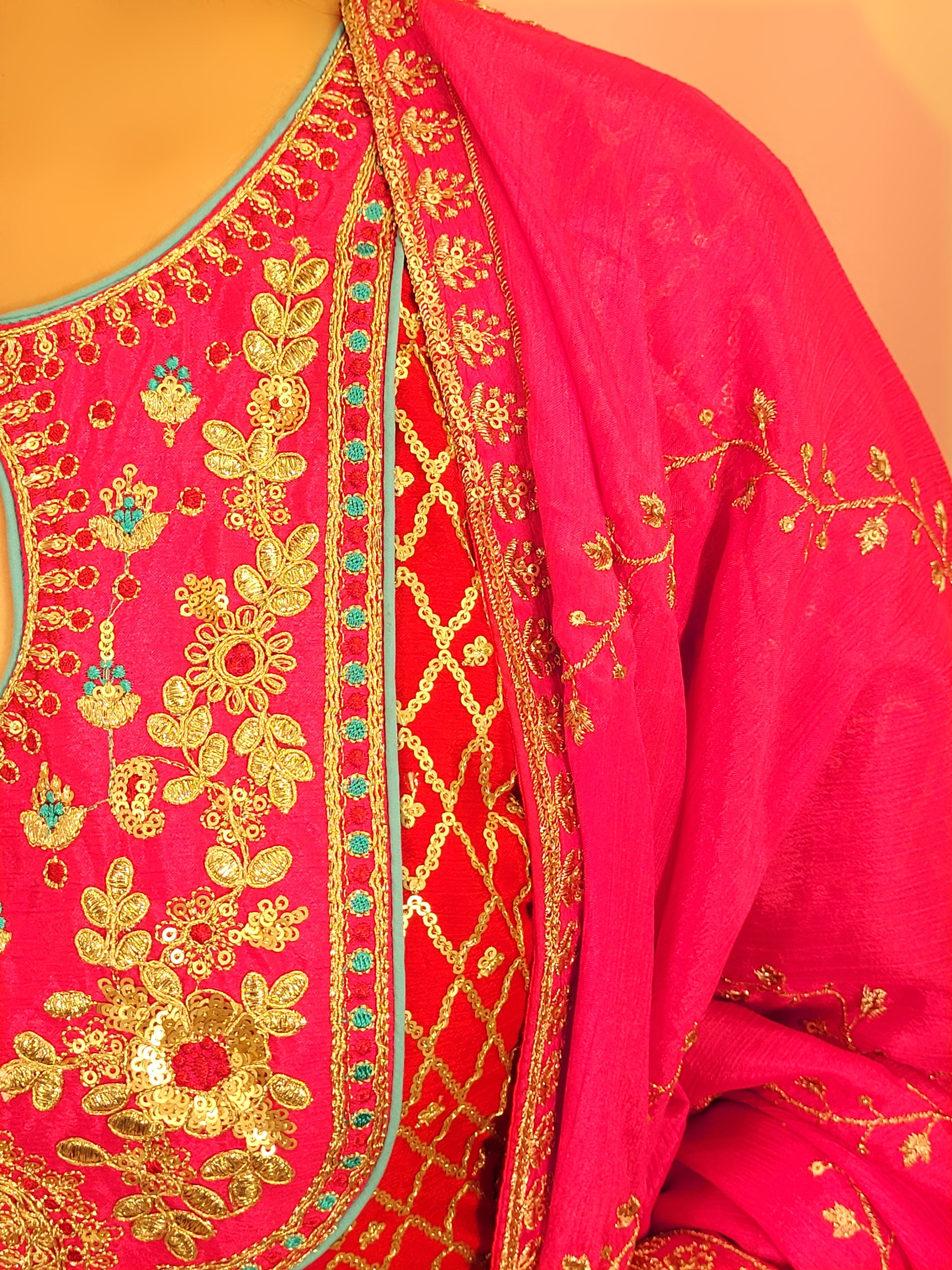 Red Chinnon Anarkali with matching Tulip Pants. Contrast neck yolk with resham, zari and sequins. Contrast Dupatta. Latest trend in Indian ethnic fusion wear.