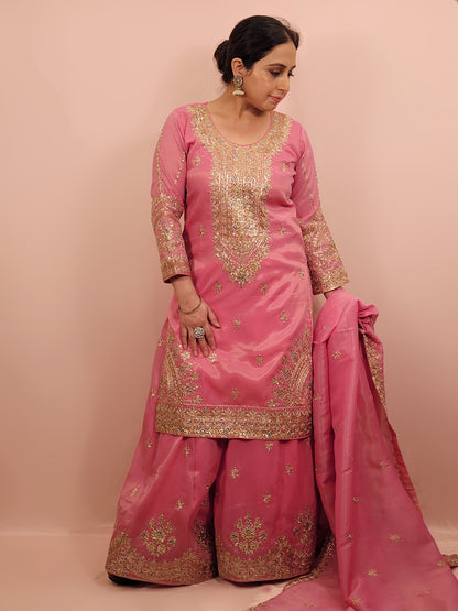 Pink Shimmer Sharara Suit. Heavy Zari Sequins Neckline. Heavy sleeves, bottom and dupatta.