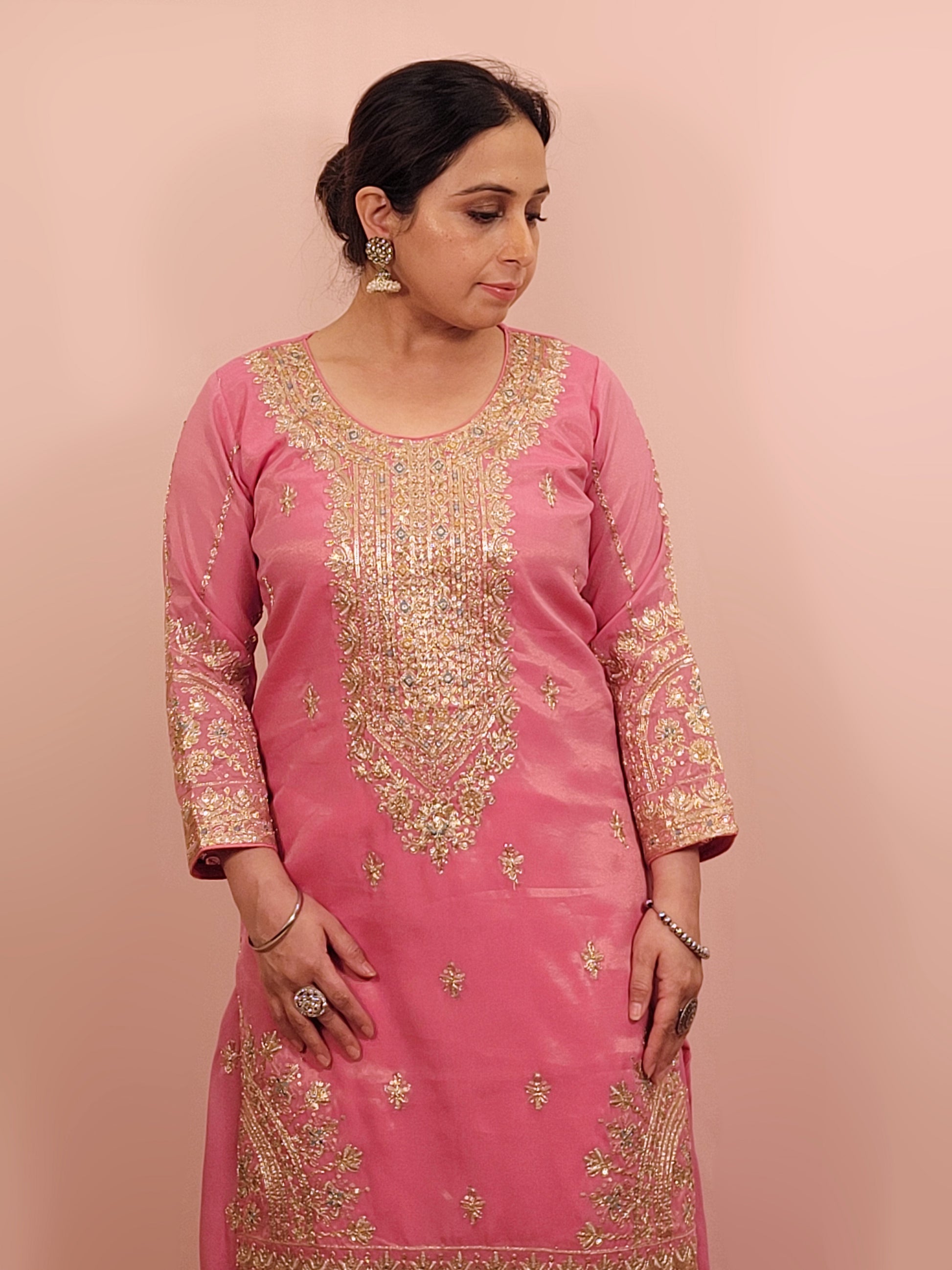 Pink Shimmer Sharara Suit. Heavy Zari Sequins Neckline. Heavy sleeves, bottom and dupatta.
