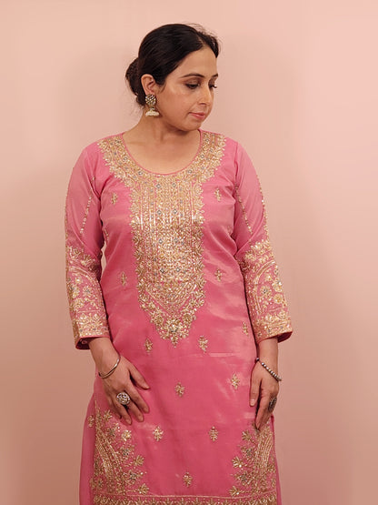 Pink Shimmer Sharara Suit. Heavy Zari Sequins Neckline. Heavy sleeves, bottom and dupatta.