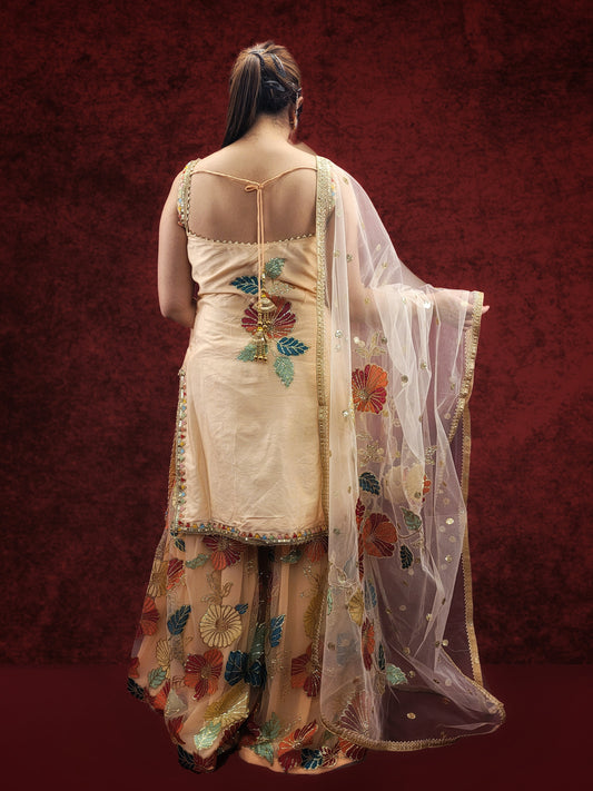Silk Top, Net Gharara and Dupatta. Threadwork Highlighted with Sequins. Perfect for party wear and festive wear.