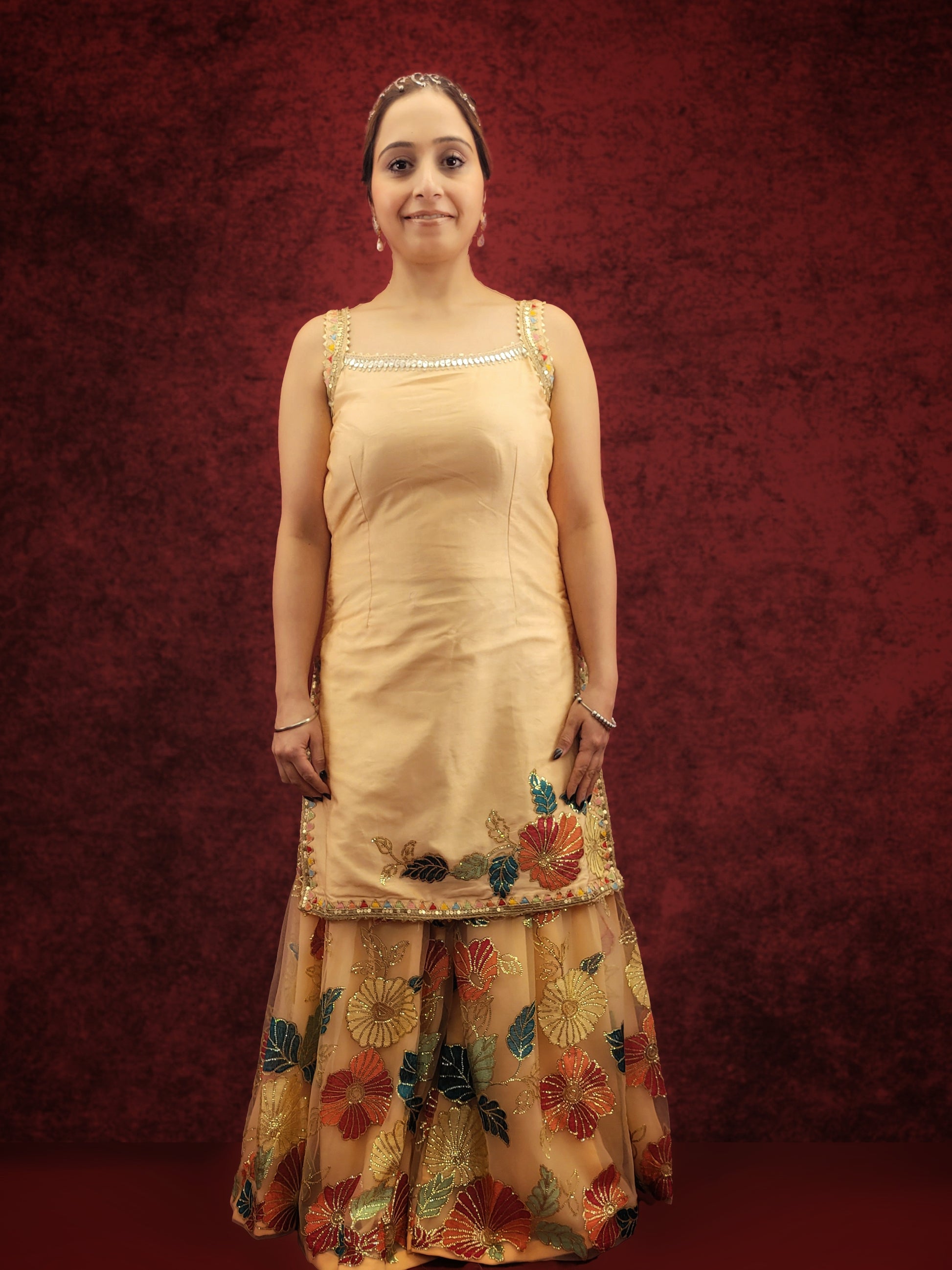 Silk Top, Net Gharara and Dupatta. Threadwork Highlighted with Sequins. Perfect for party wear and festive wear.