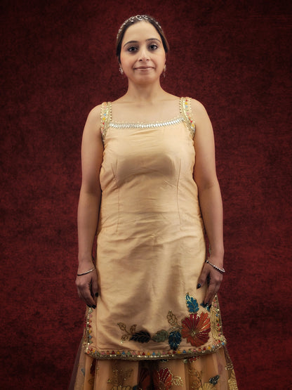 Silk Top, Net Gharara and Dupatta. Threadwork Highlighted with Sequins. Perfect for party wear and festive wear.