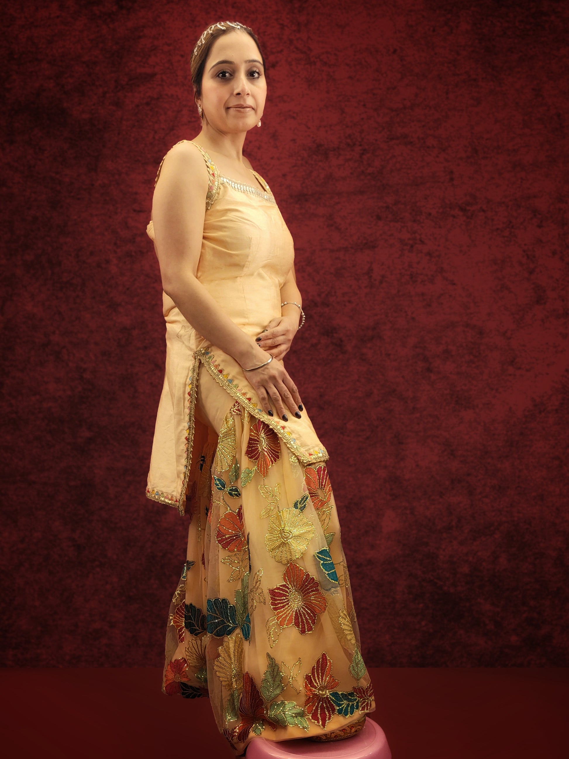 Silk Top, Net Gharara and Dupatta. Threadwork Highlighted with Sequins. Perfect for party wear and festive wear.