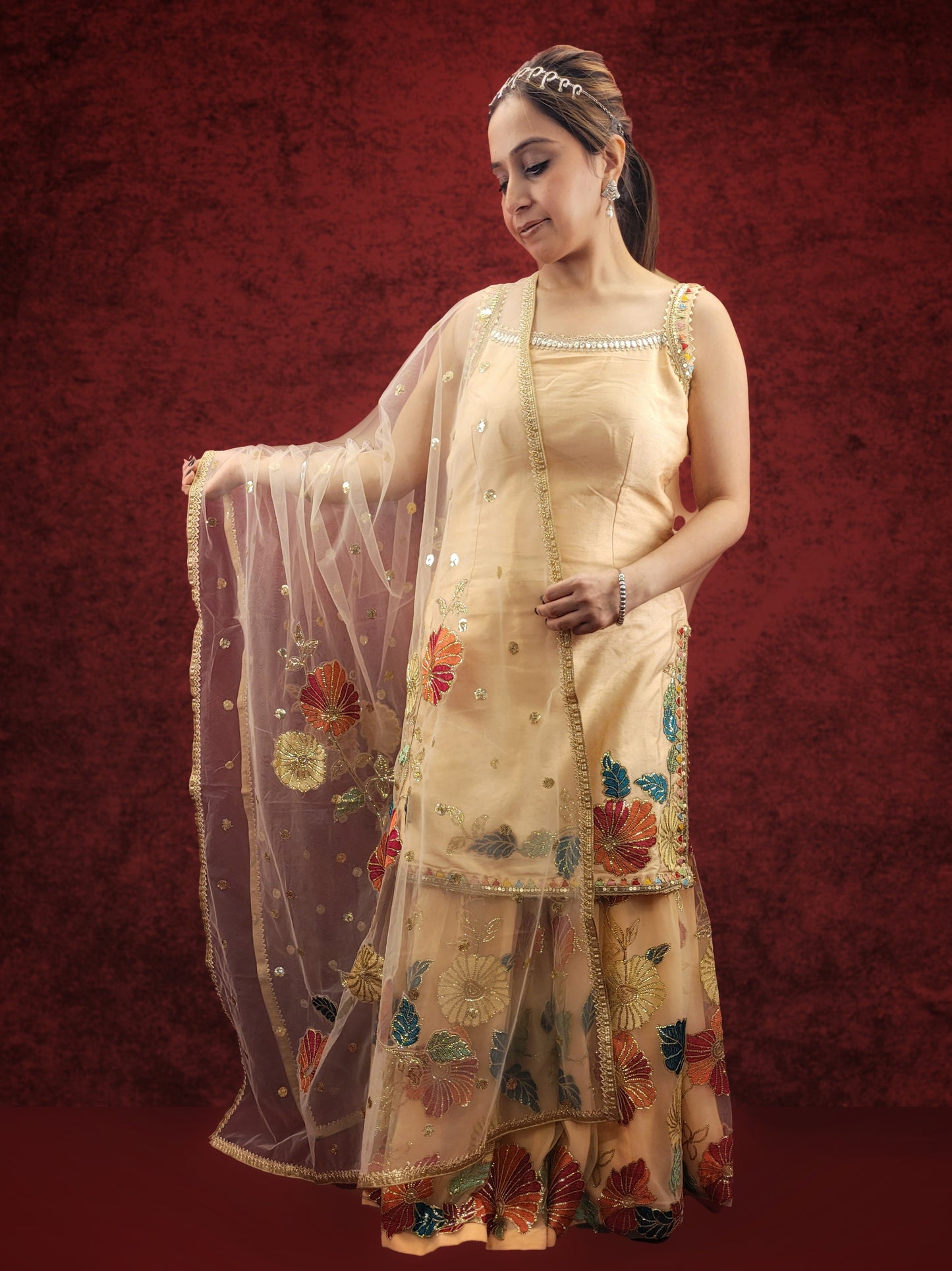Silk Top, Net Gharara and Dupatta. Threadwork Highlighted with Sequins. Perfect for party wear and festive wear.