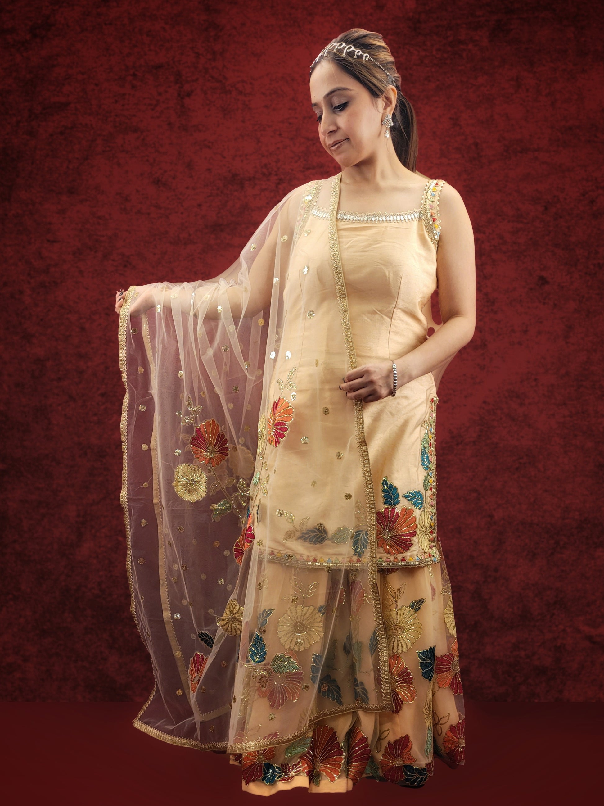 Silk Top, Net Gharara and Dupatta. Threadwork Highlighted with Sequins. Perfect for party wear and festive wear.