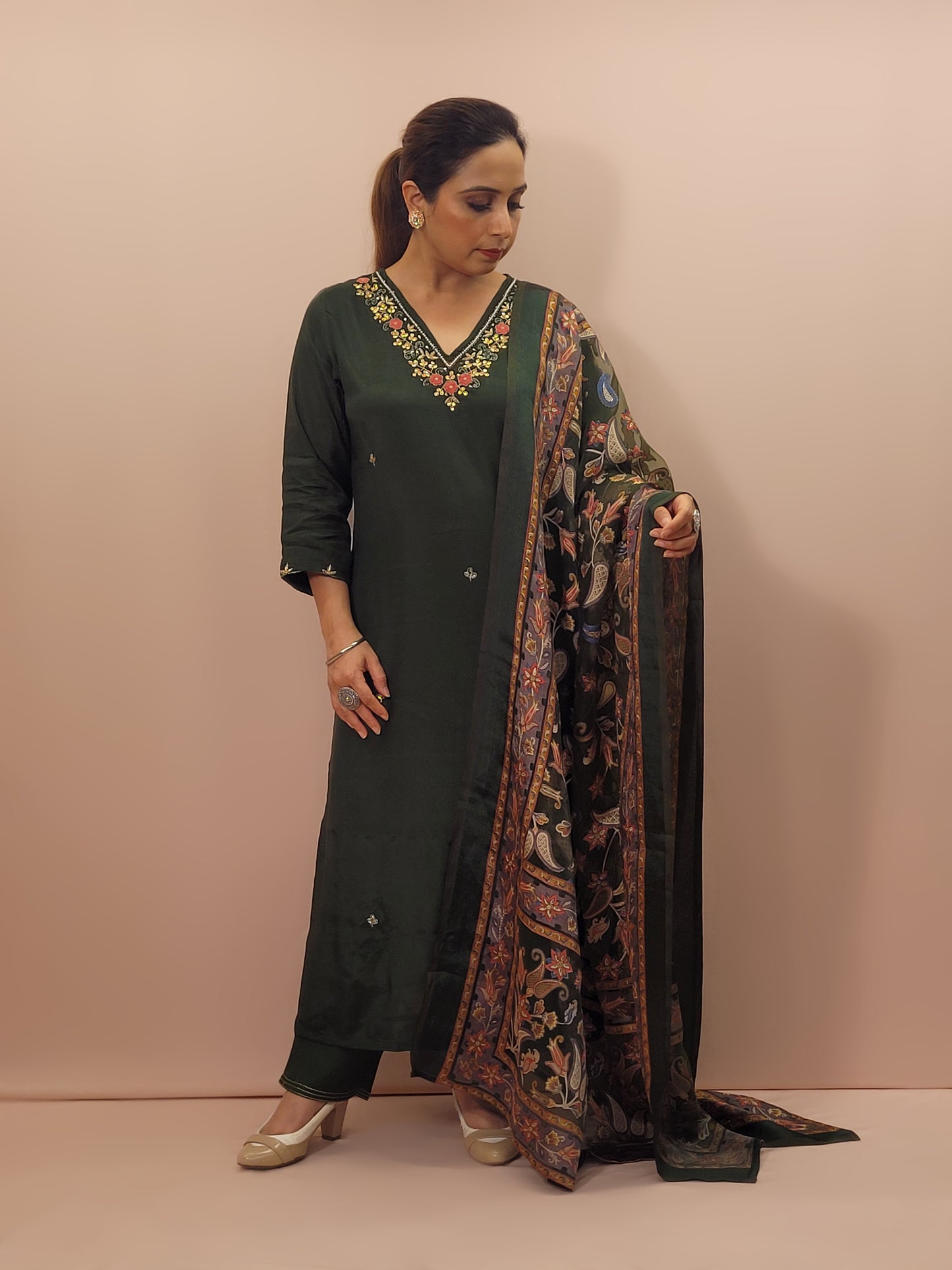 Muslin Green Suit with Designer multicolor Brasso Dupatta. Hand Embroidered Neckline using Resham, Dabka, and Beads.