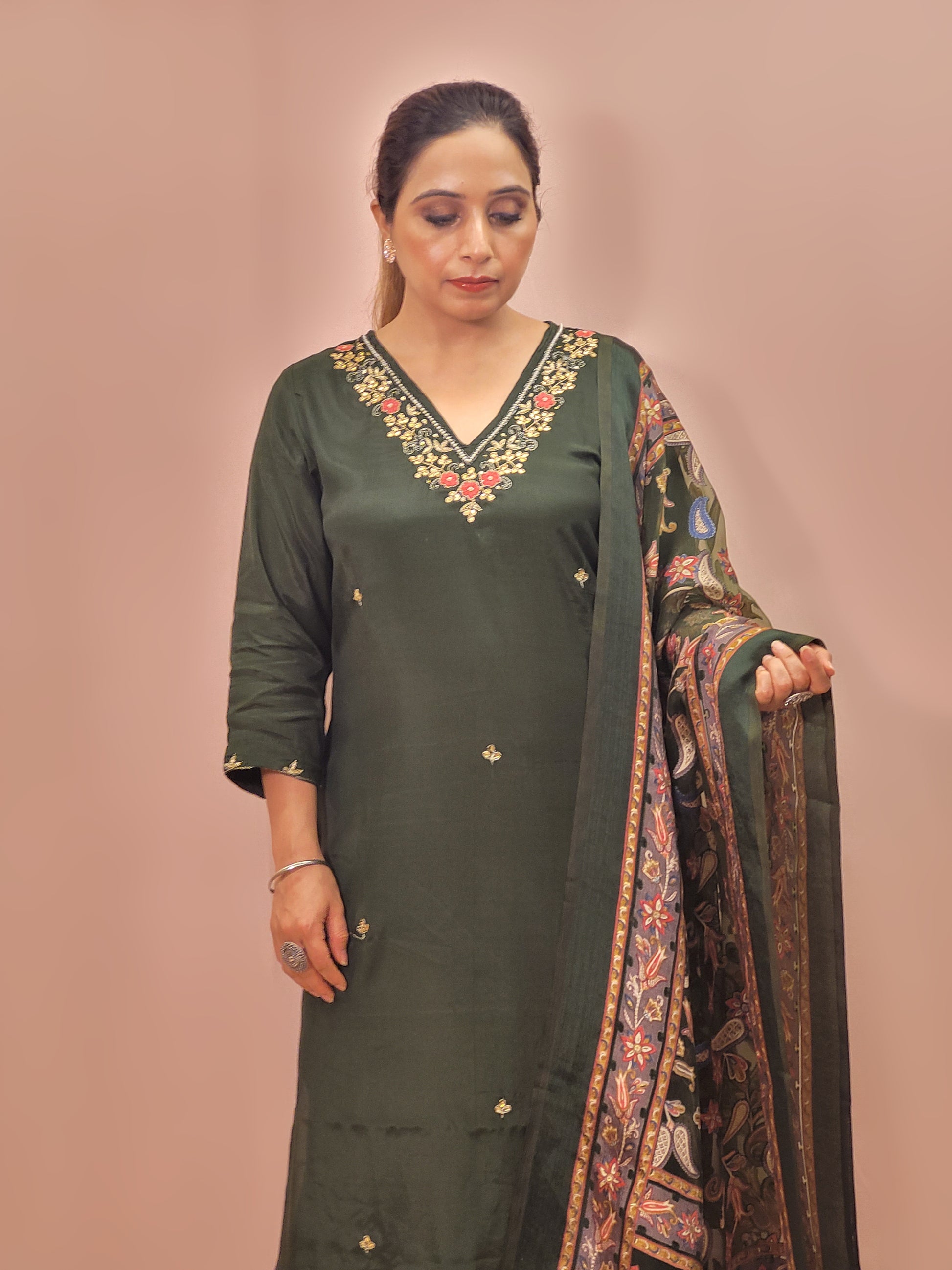 Muslin Green Suit with Designer multicolor Brasso Dupatta. Hand Embroidered Neckline using Resham, Dabka, and Beads.