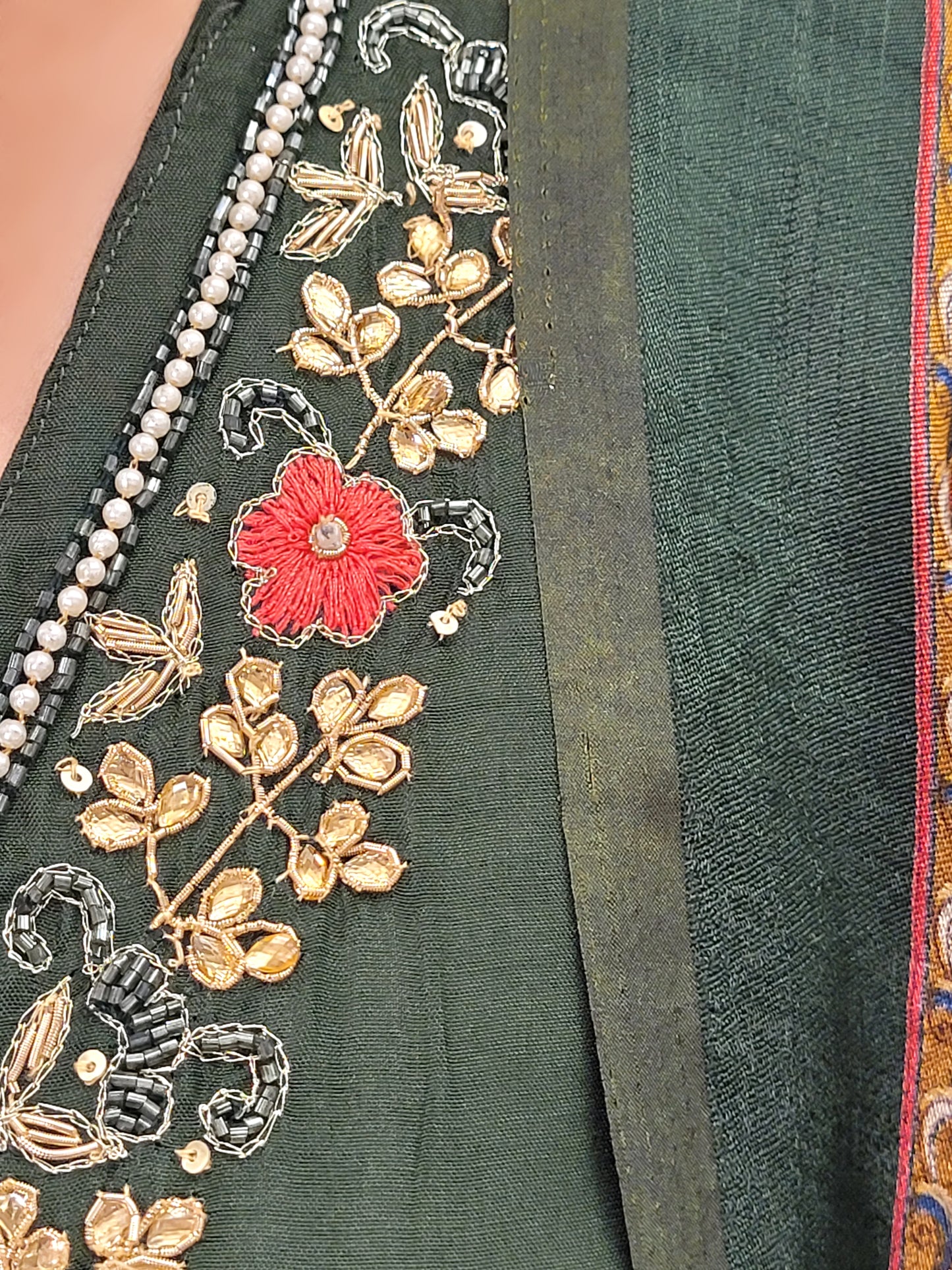 Muslin Green Suit with Designer multicolor Brasso Dupatta. Hand Embroidered Neckline using Resham, Dabka, and Beads.